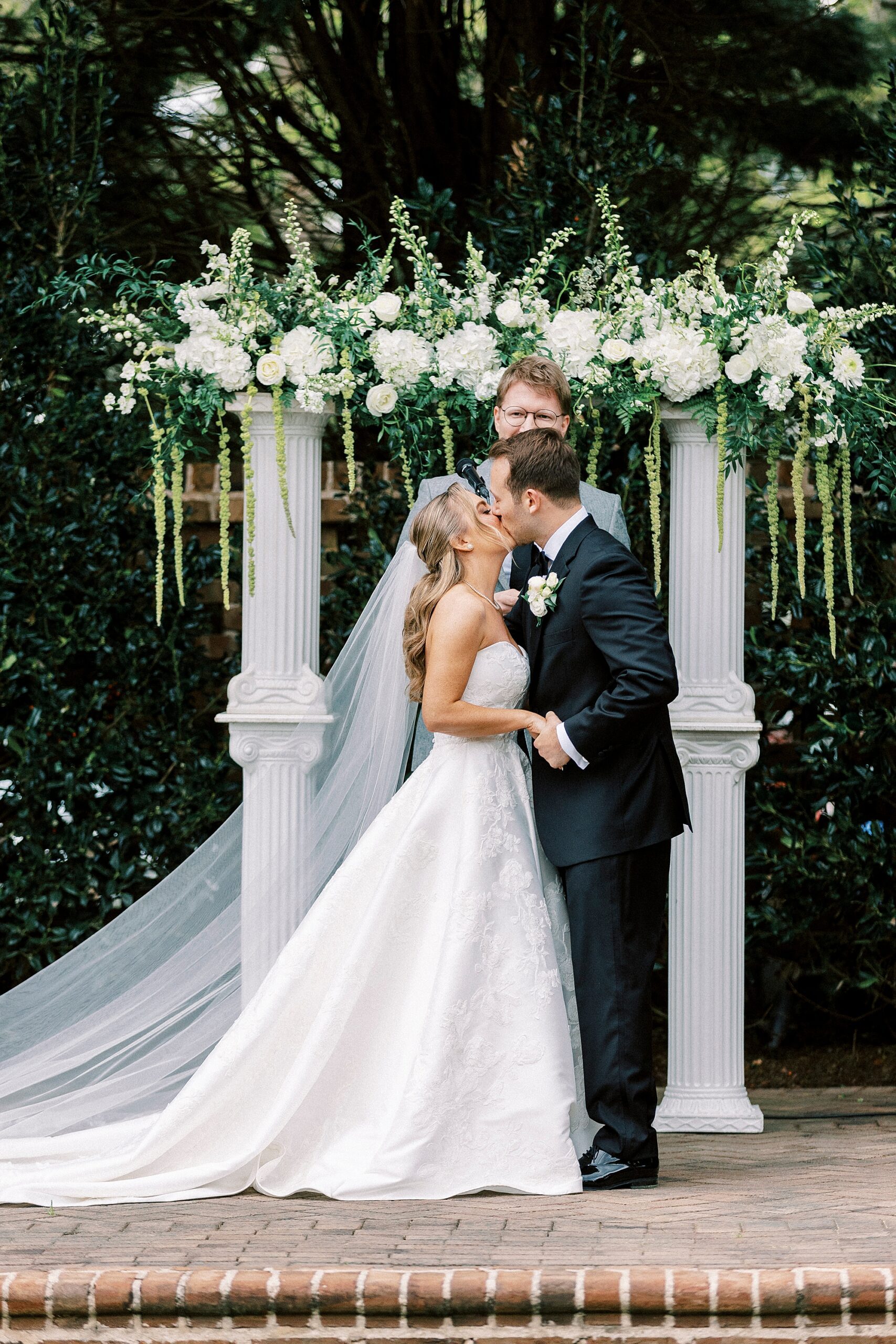 bride and groom kiss during wedding ceremony at the Sutherland