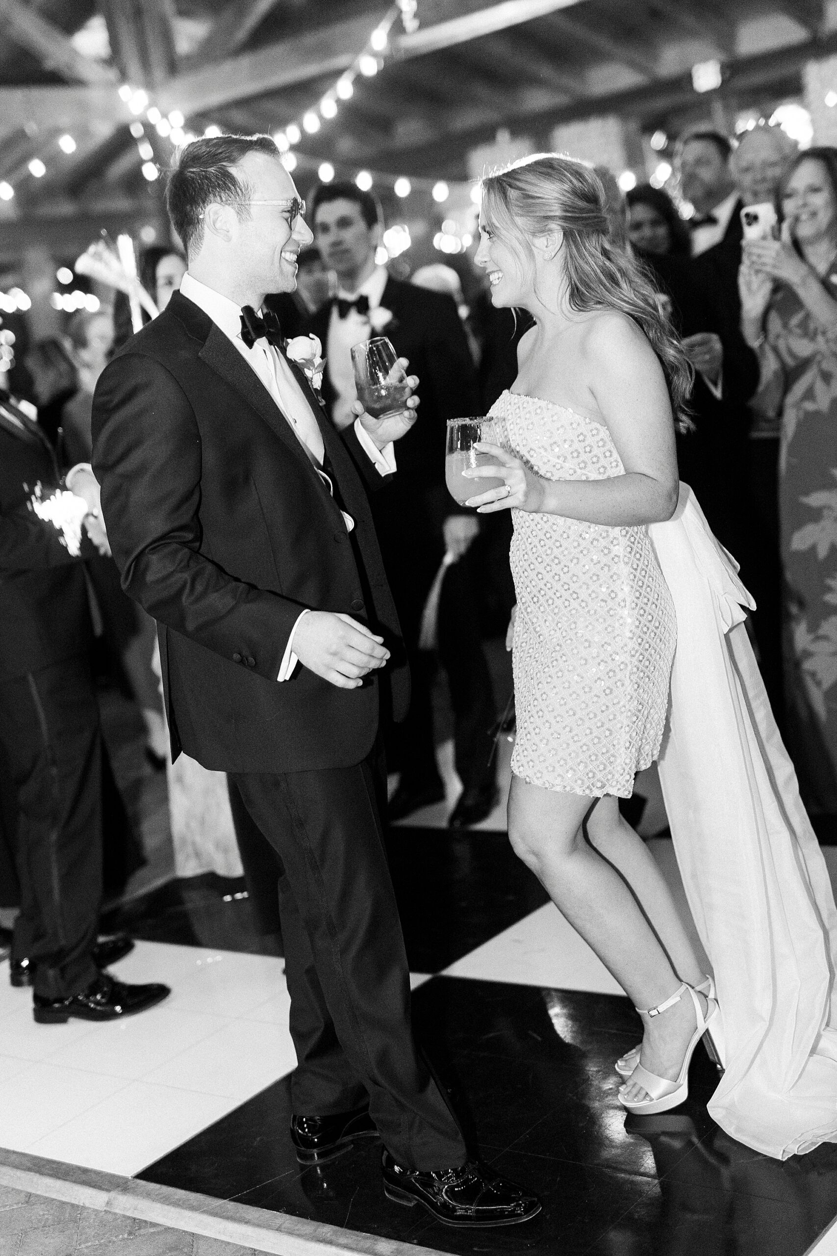 bride and groom dance together during Wake Forest NC wedding reception in pavilion