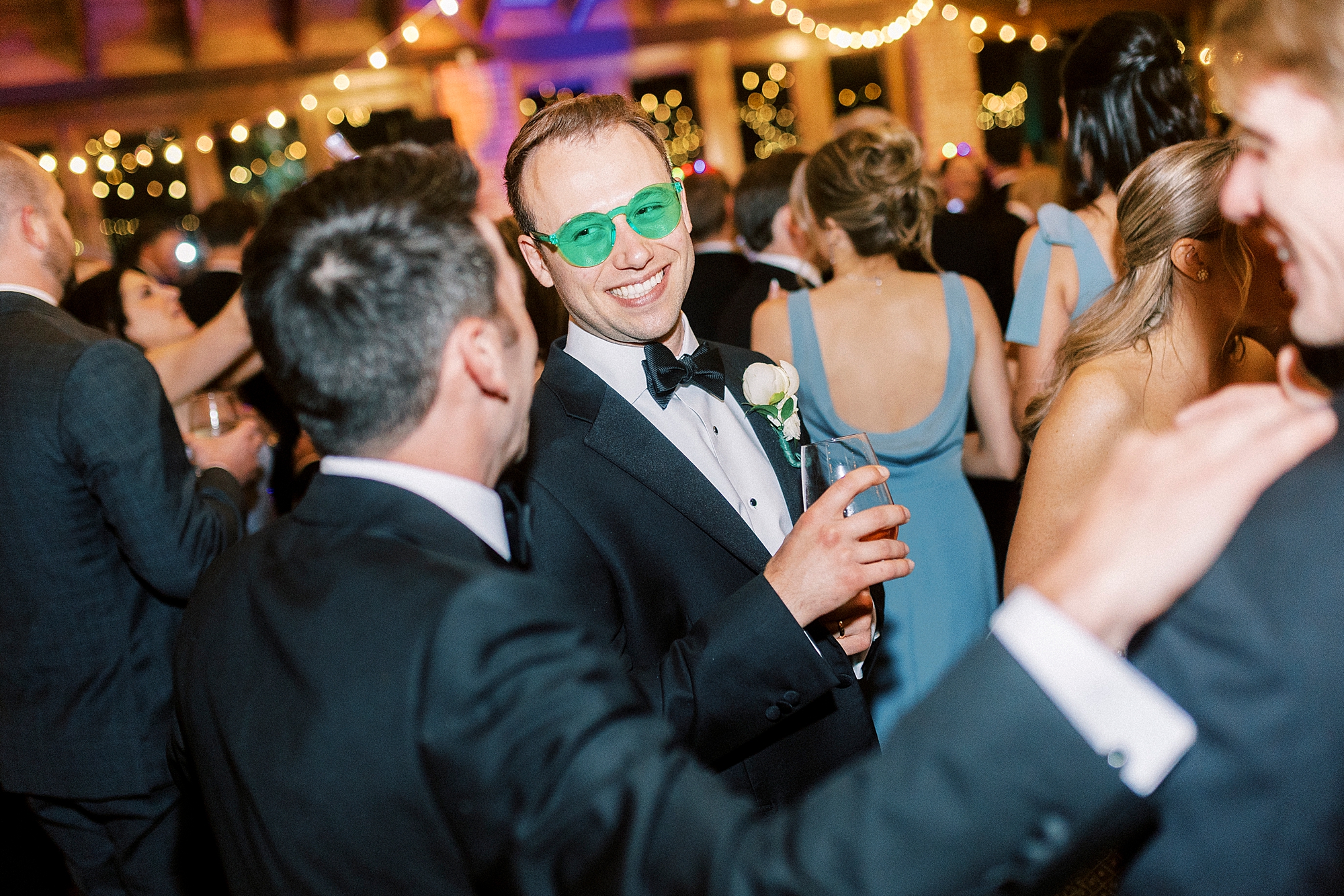guests dance during Wake Forest NC wedding reception in pavilion
