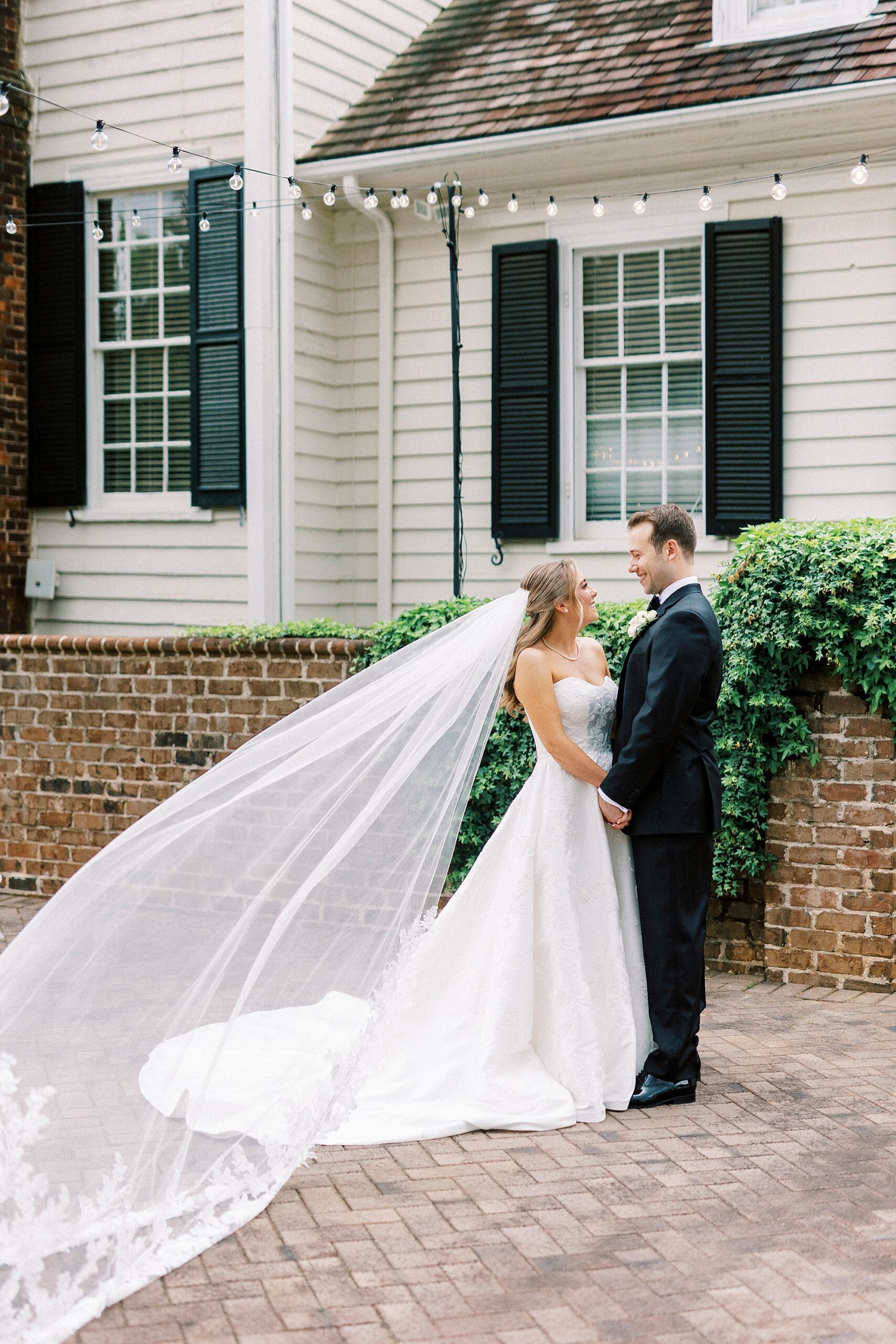 newlyweds hug in front of the Sutherland
