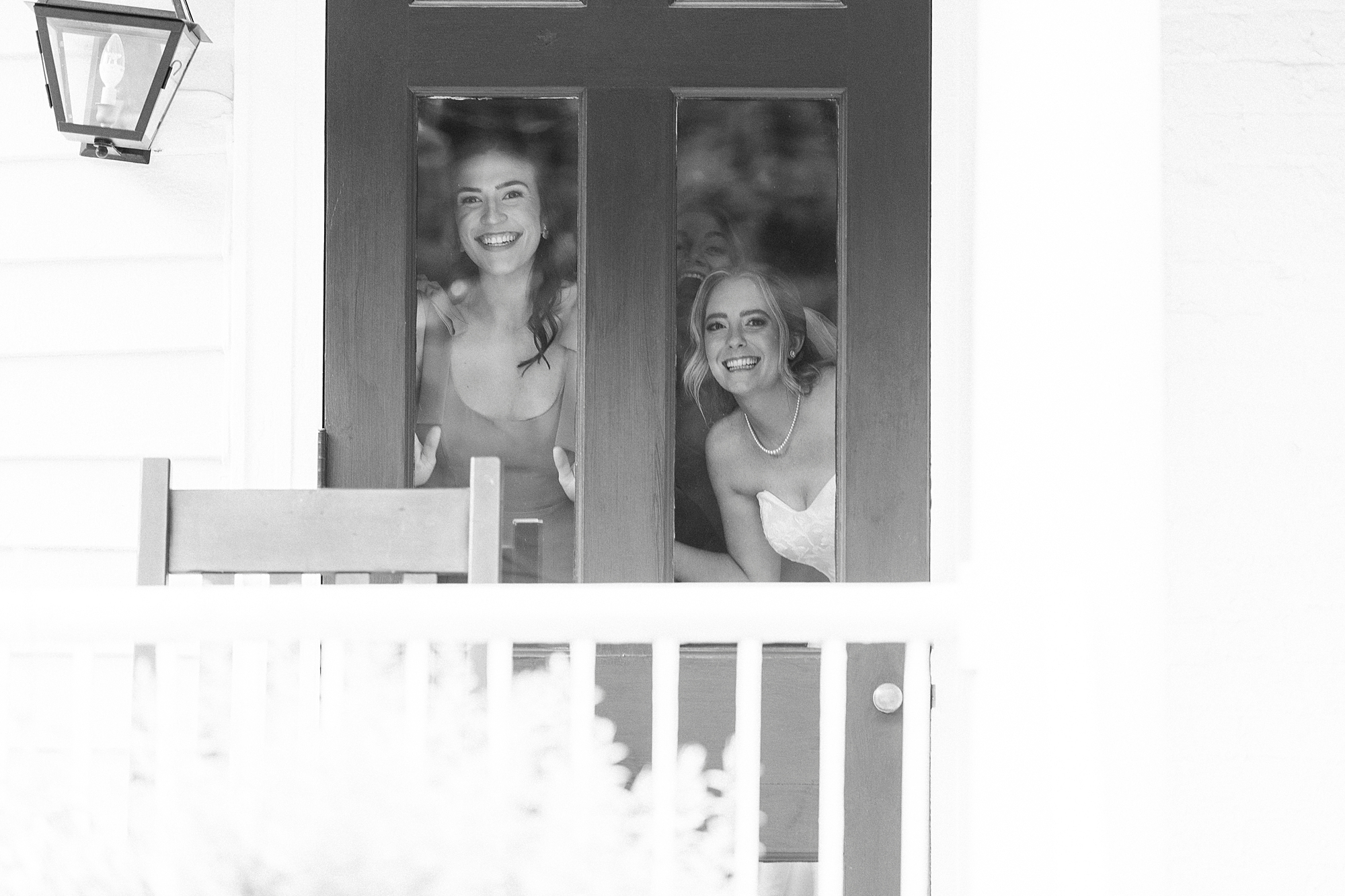 bridesmaids peek out of window at the Sutherland