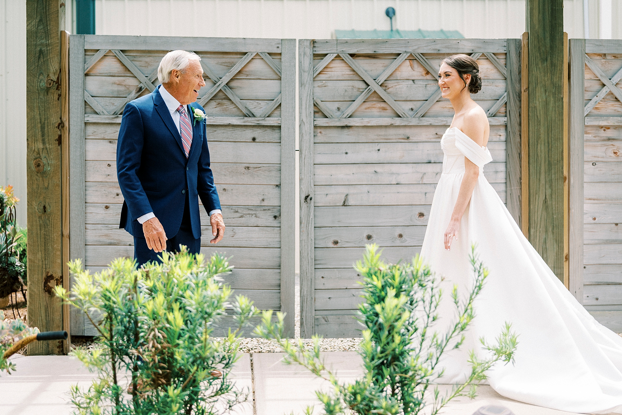 bride approaches father for first look on patio at Low Meadows Estate