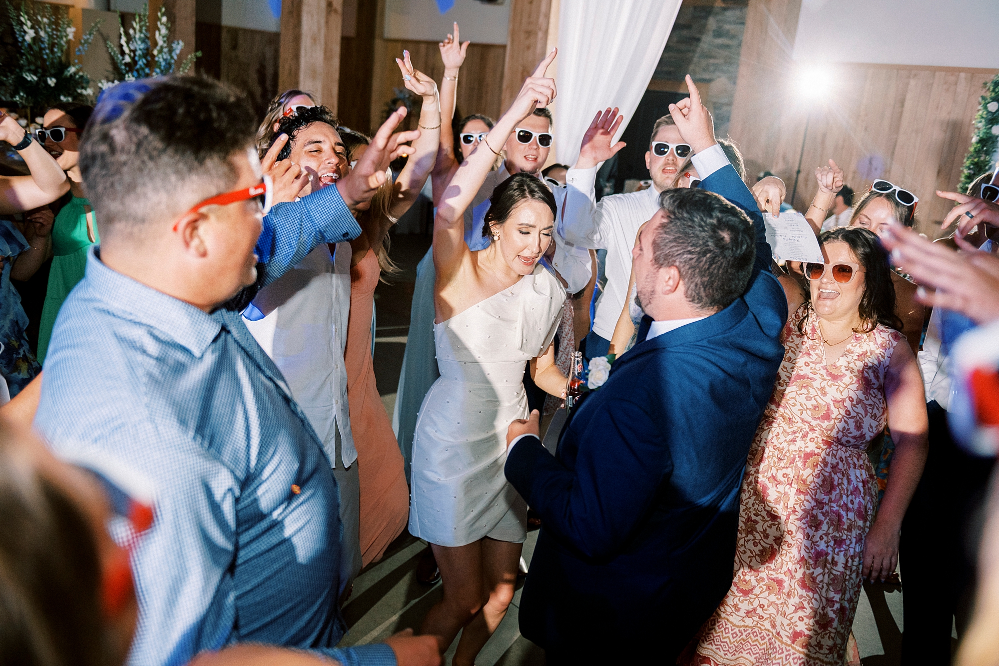 bride dances with guests during wedding reception in Belmont NC