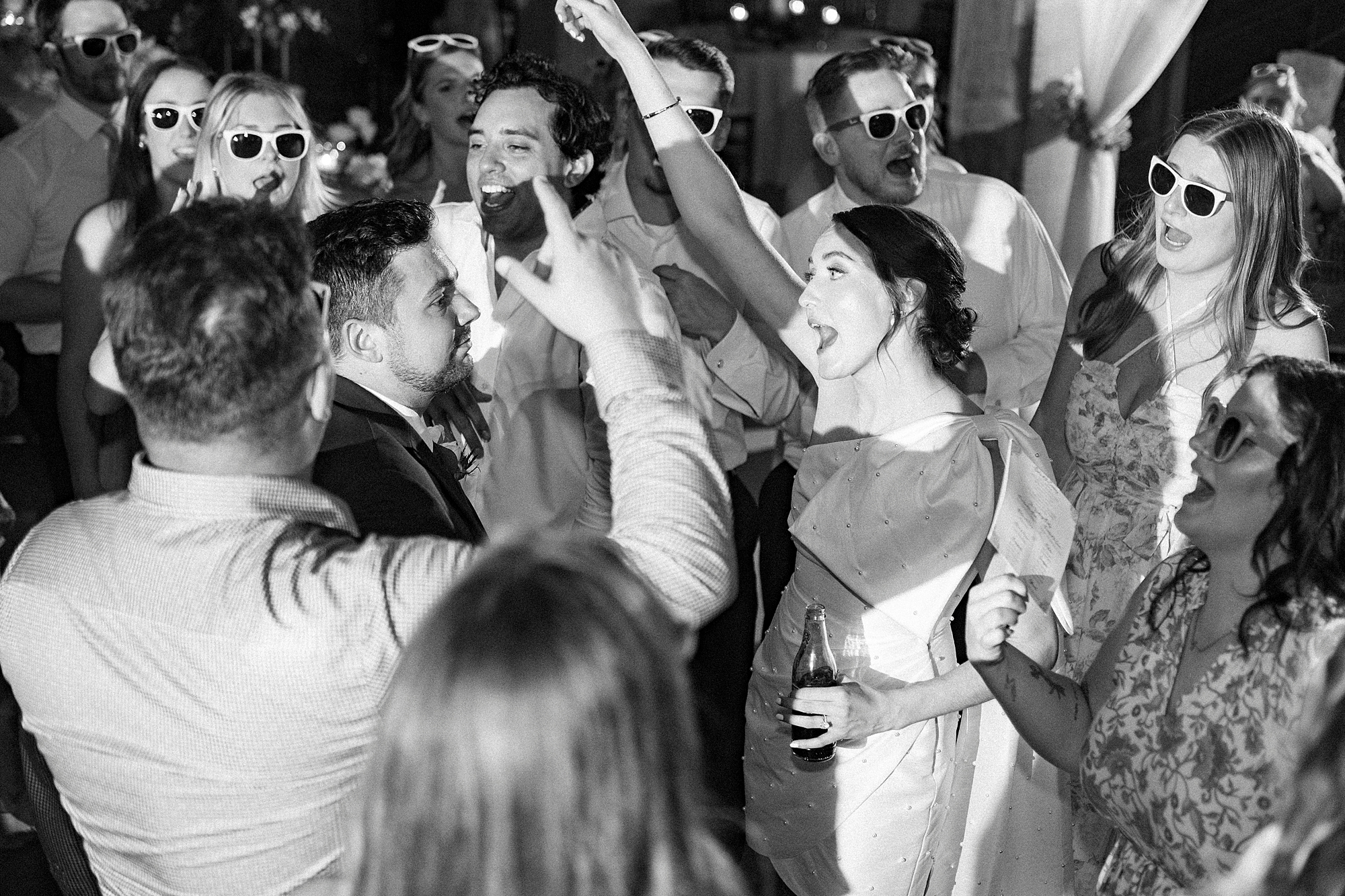 bride dances with guests during wedding reception in Belmont NC