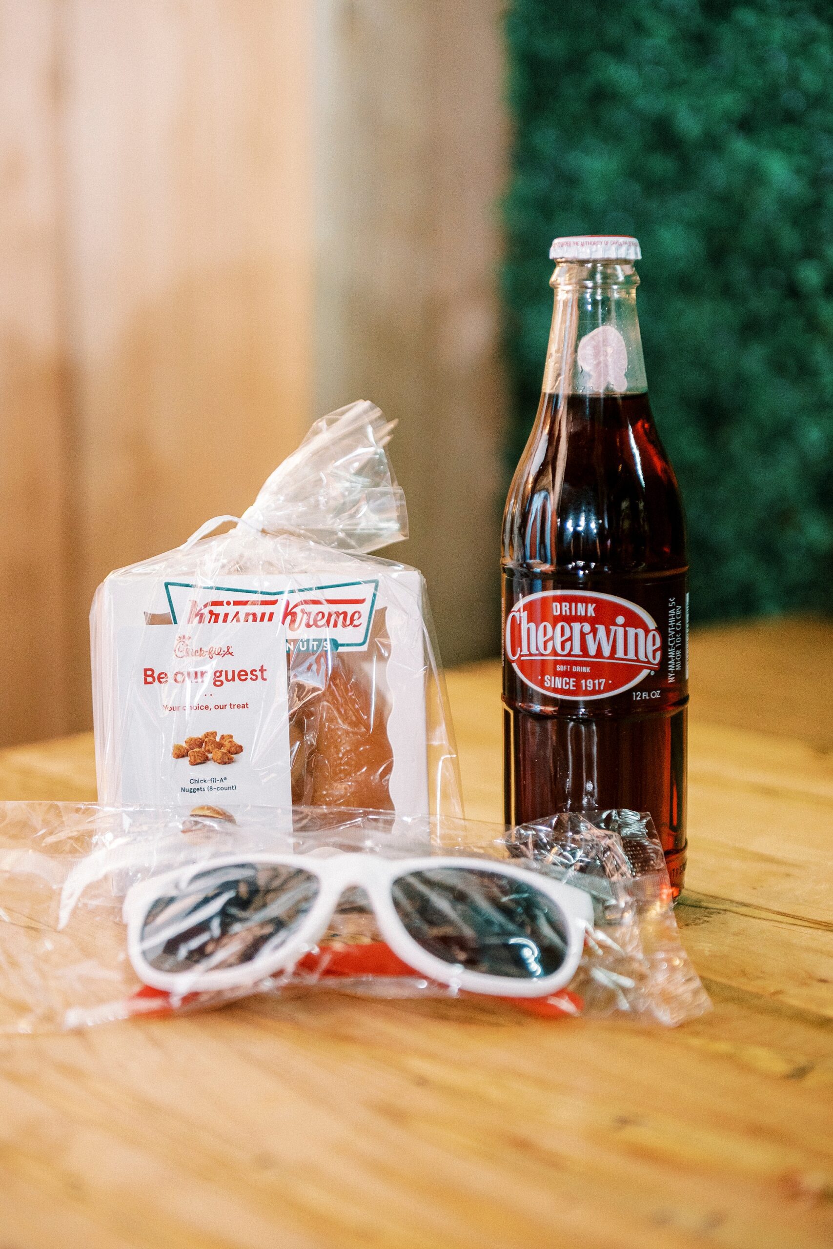 cheer wine and Krispy Kreme donuts with sunglasses for guests