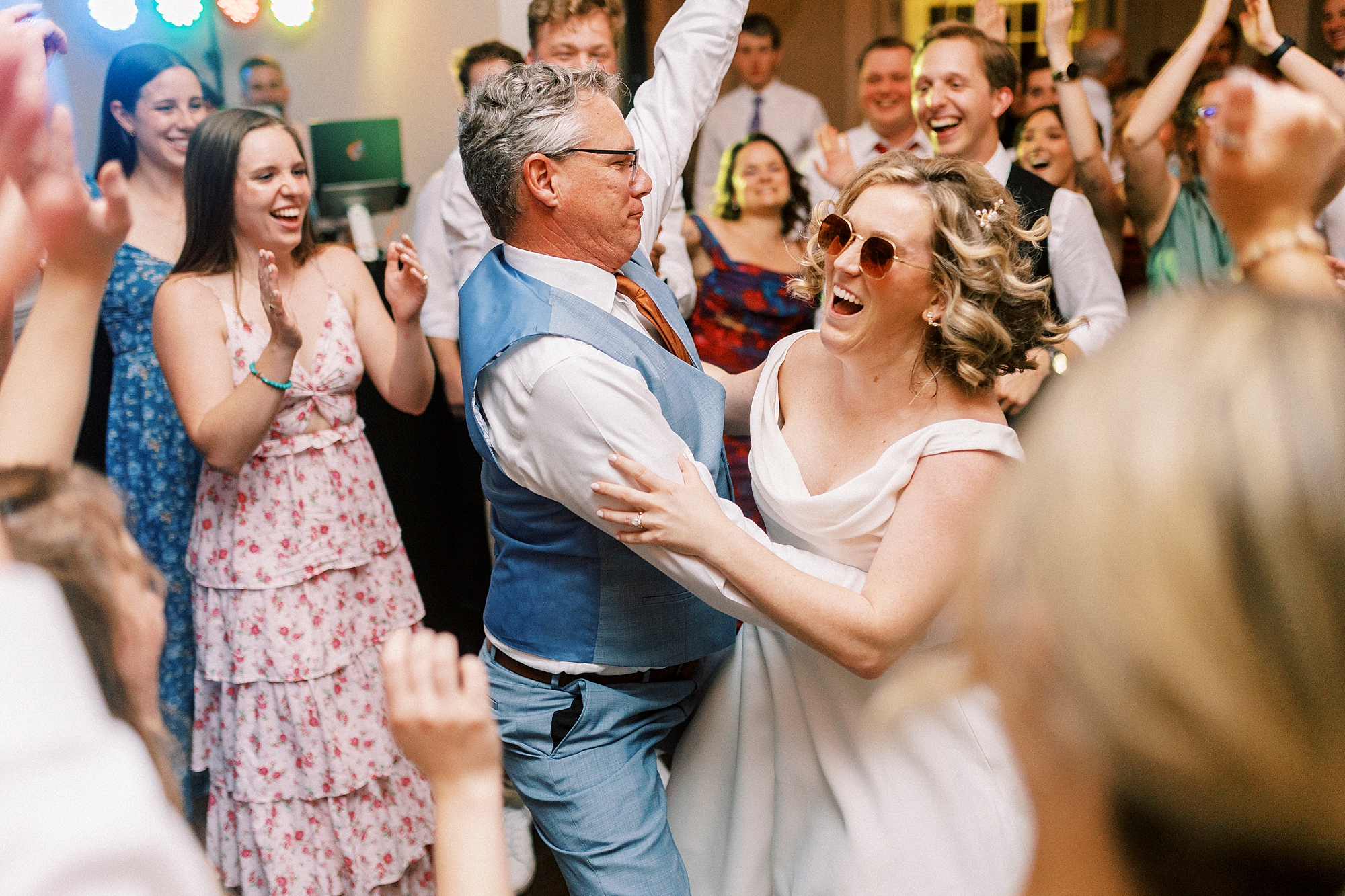 bride dances with guests during NC wedding reception at Separk Mansion