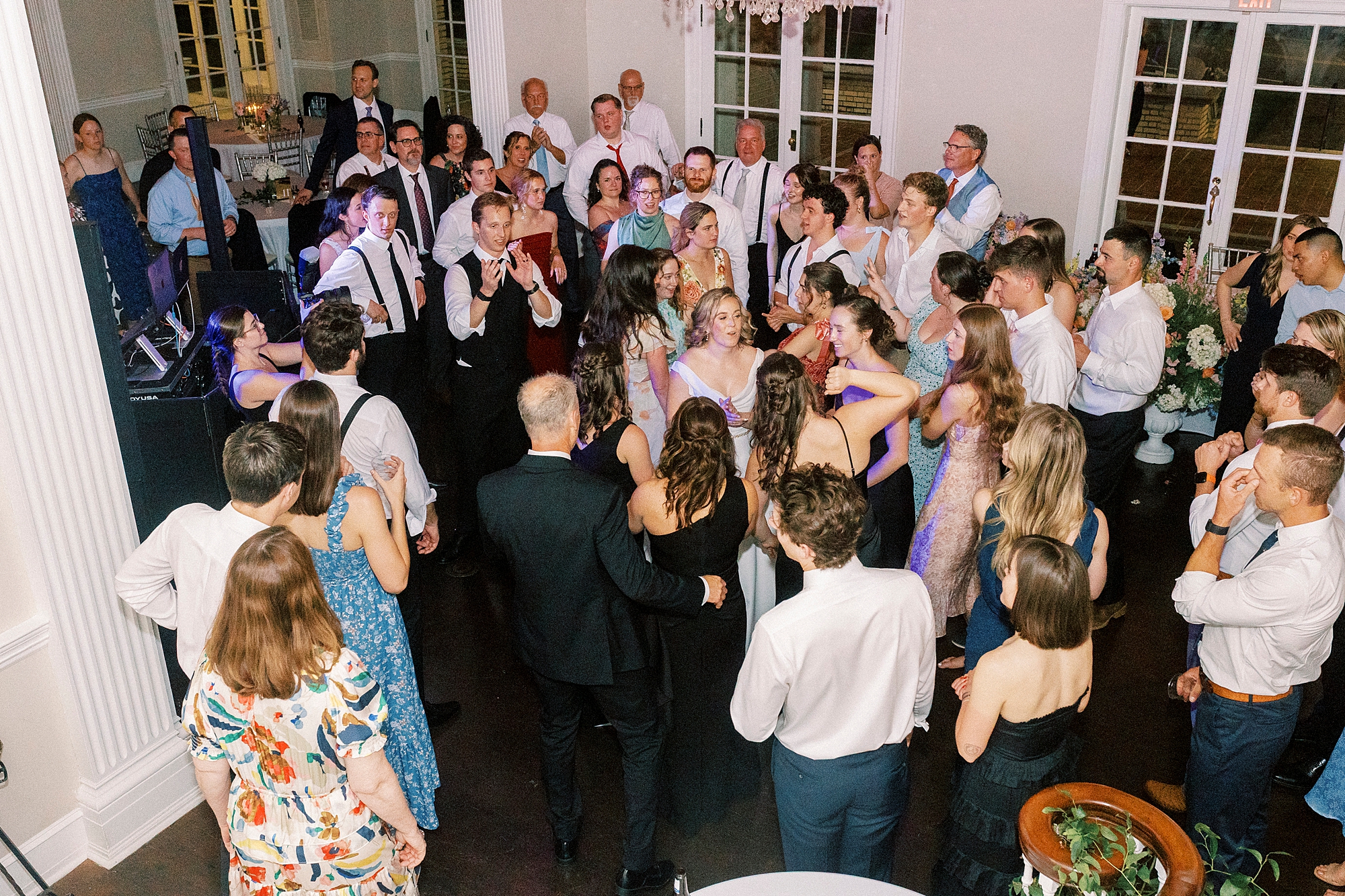 wedding guests dance with bride and groom at Separk Mansion
