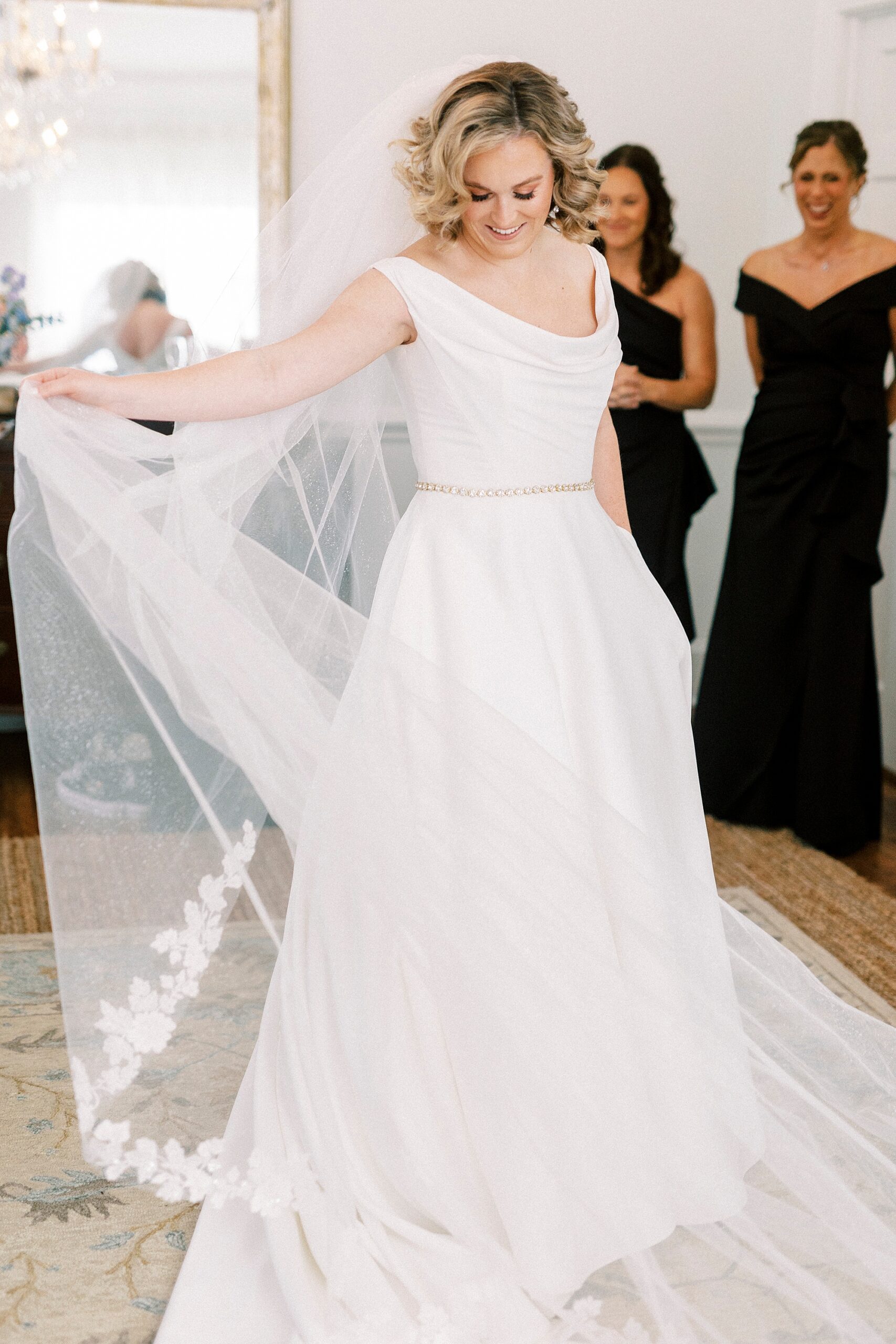 bride pulls veil around her inside Separk Mansion