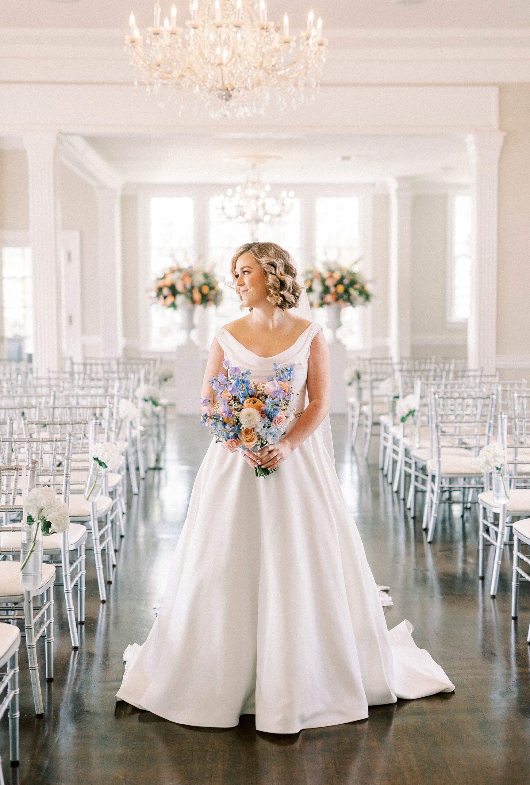 bride poses in aisle of ceremony site at Separk Mansion