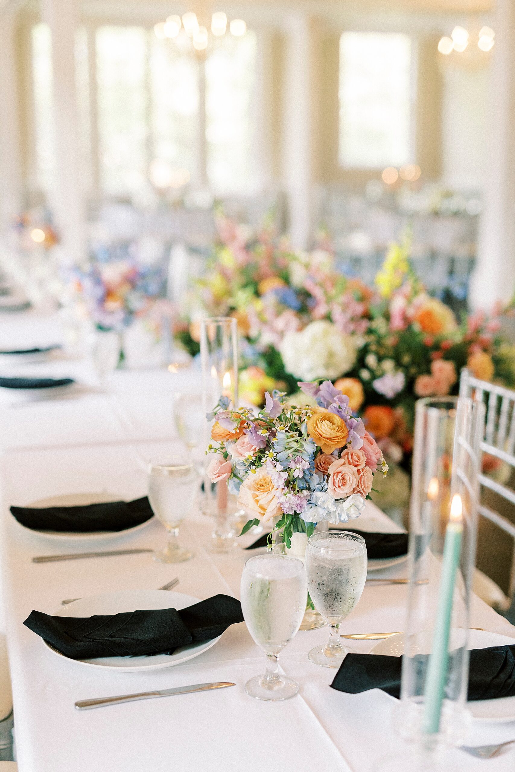 spring wedding reception with taper candles and flowers