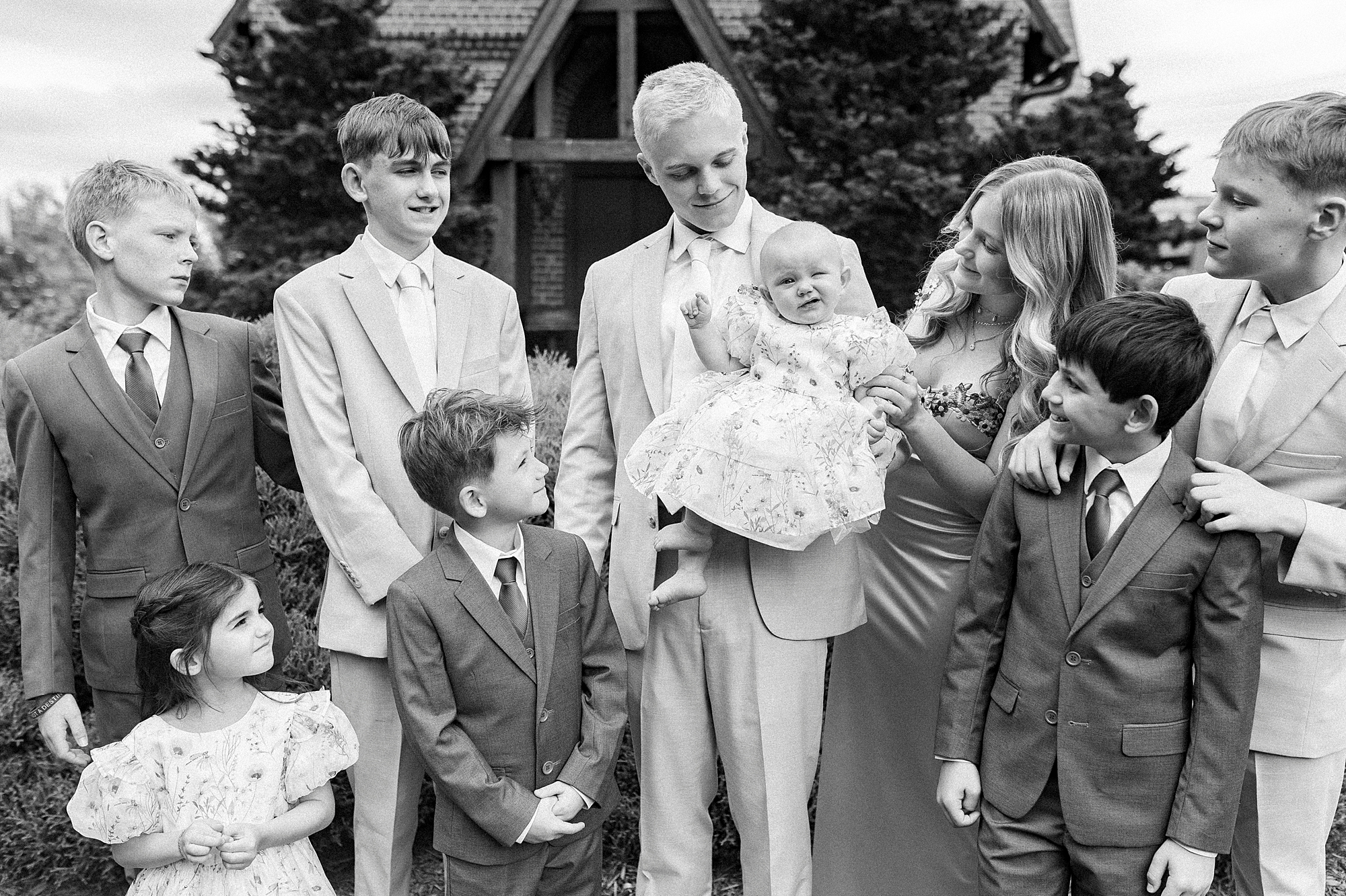 children smile standing together outside chapel 