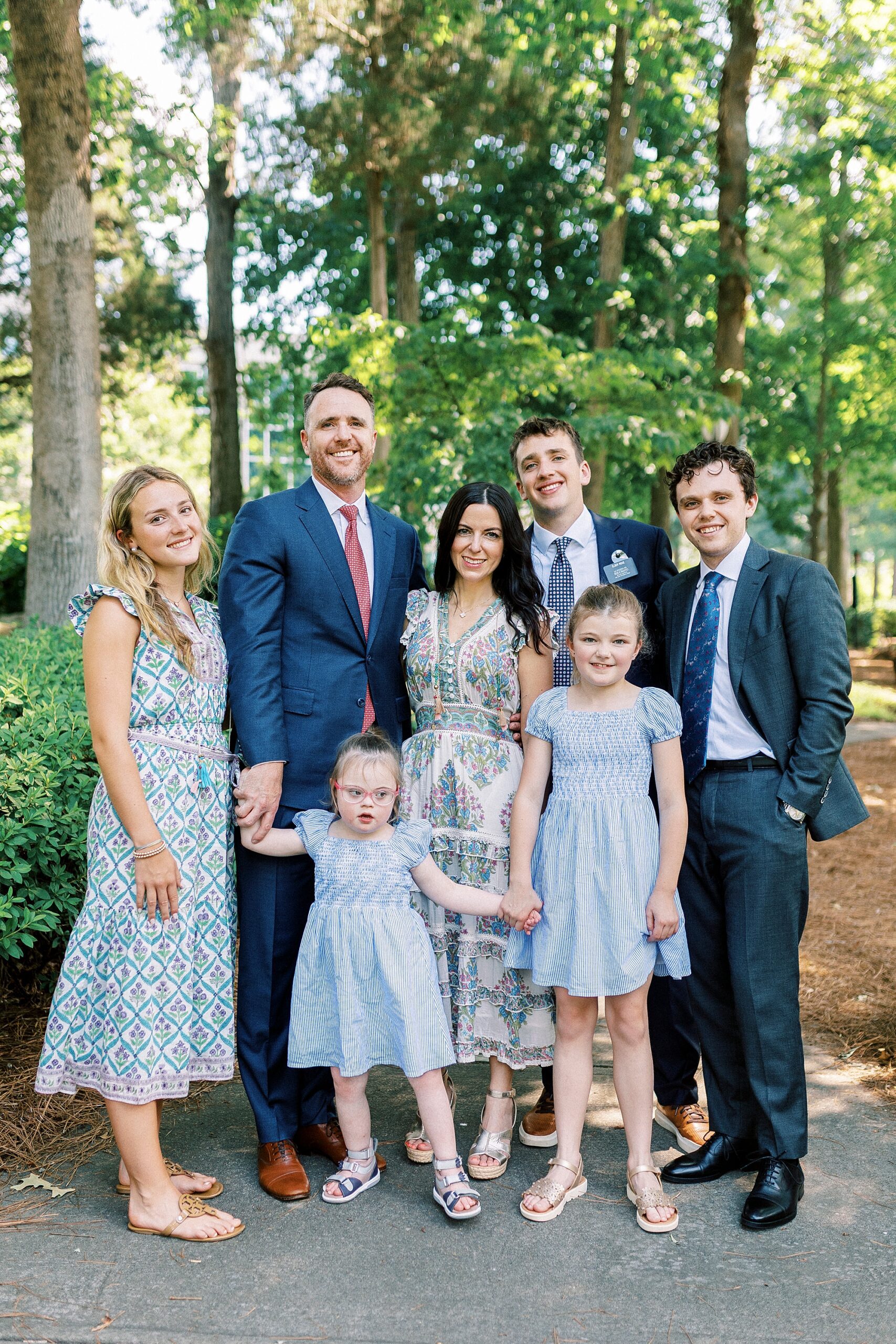 parents stand with five children on pathway at Cullman Park