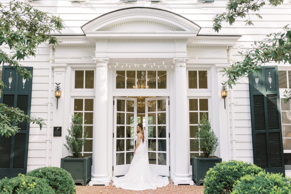 bride at French doors at duke mansion wedding venue in Charlotte 
