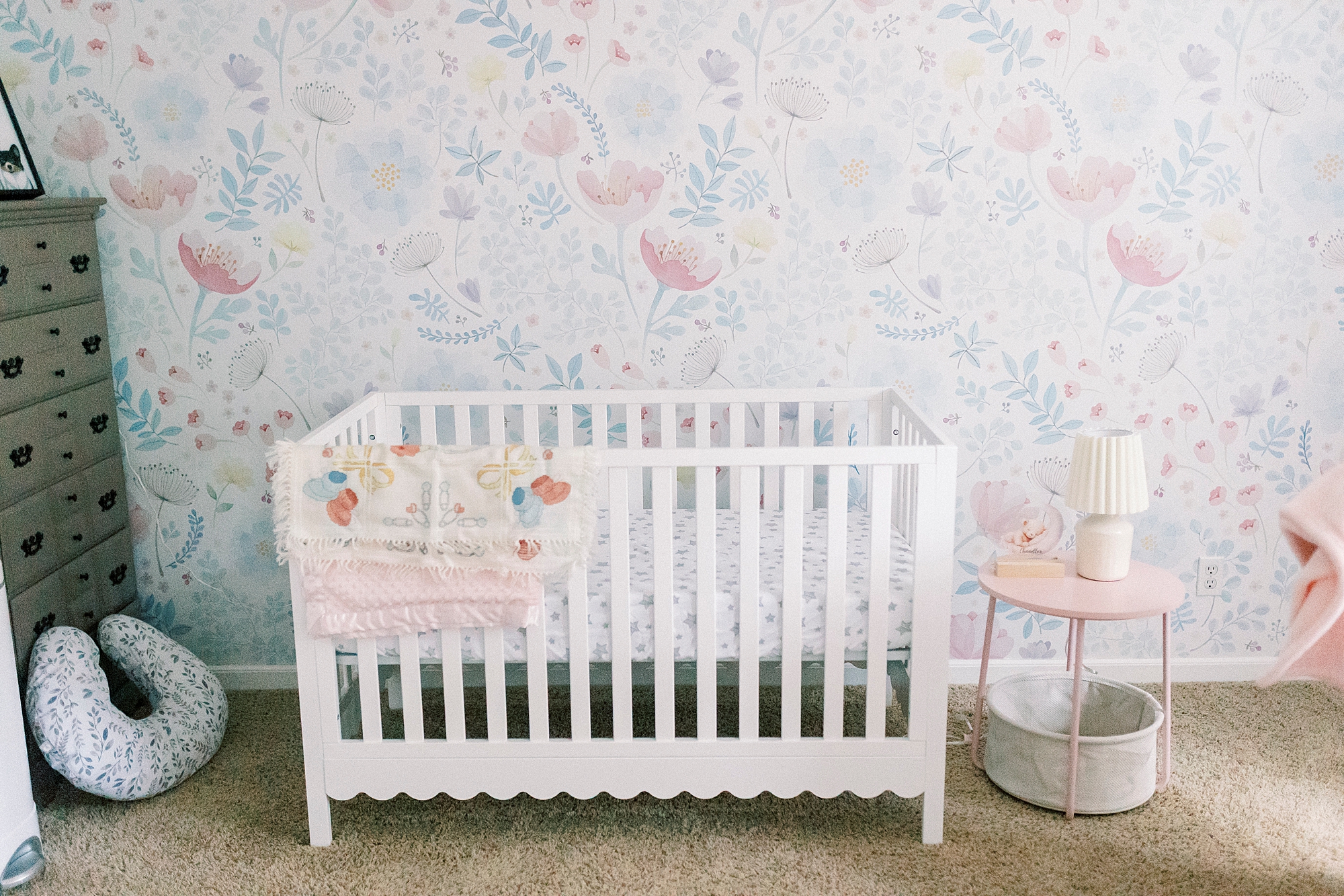 white wooden crib in nursery of NC home