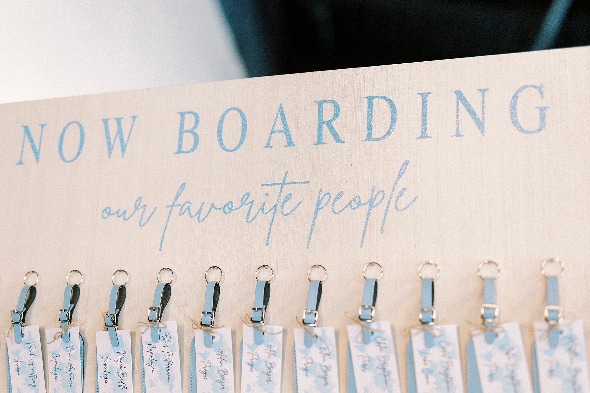 luggage tag seating chart for wedding reception at Terrace at Cedar Hill