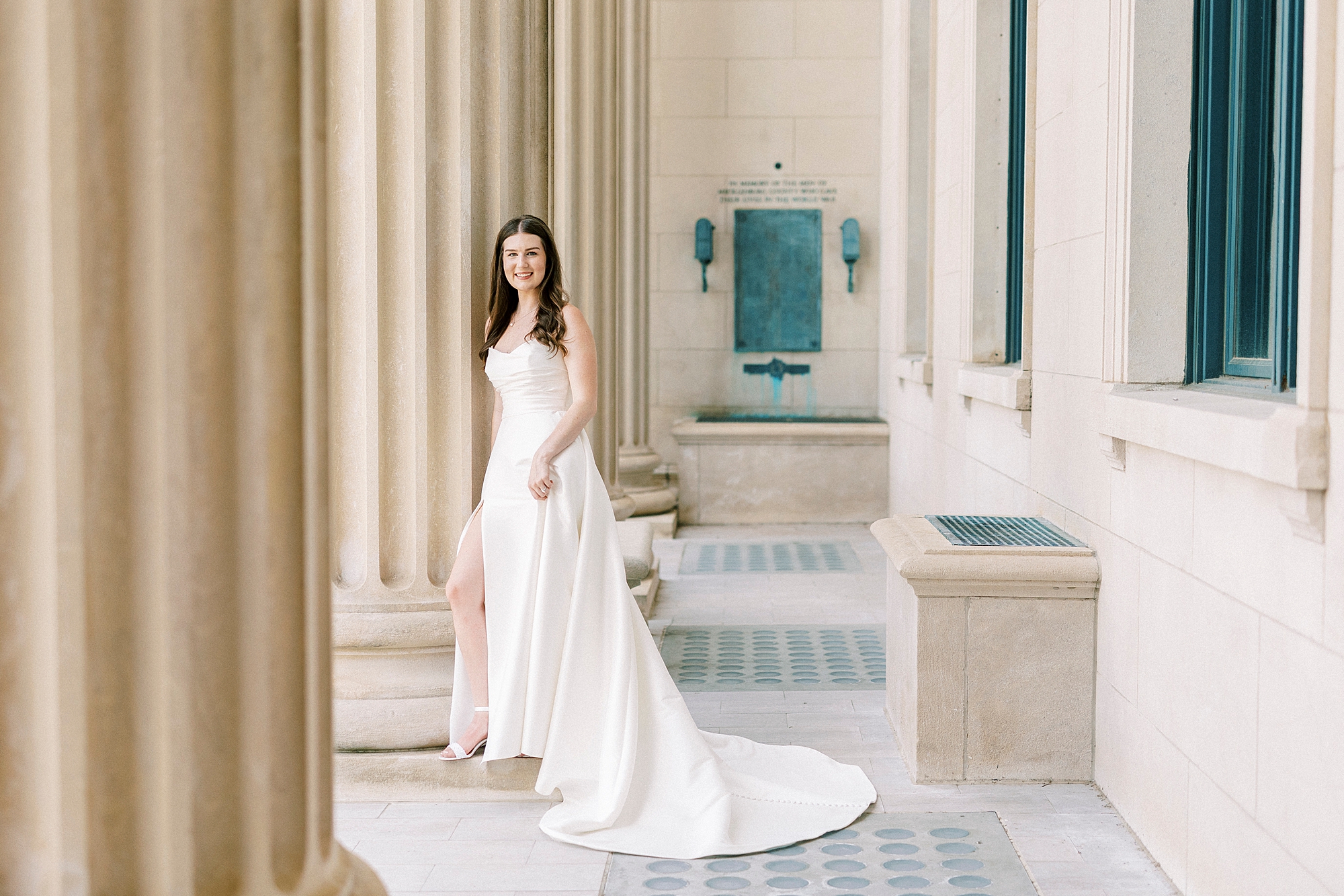 bride leads against pillar at Charlotte NC building 