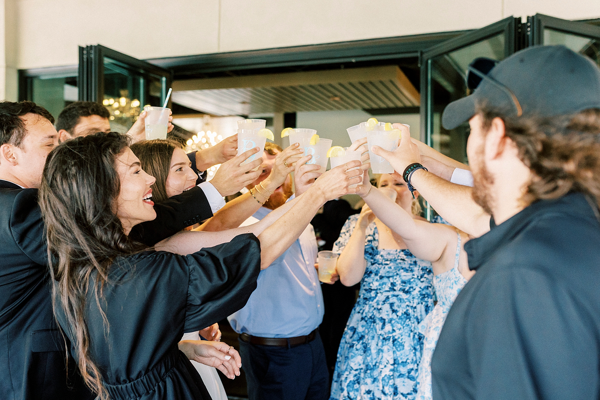guests toast cocktails during reception at Terrace at Cedar Hill