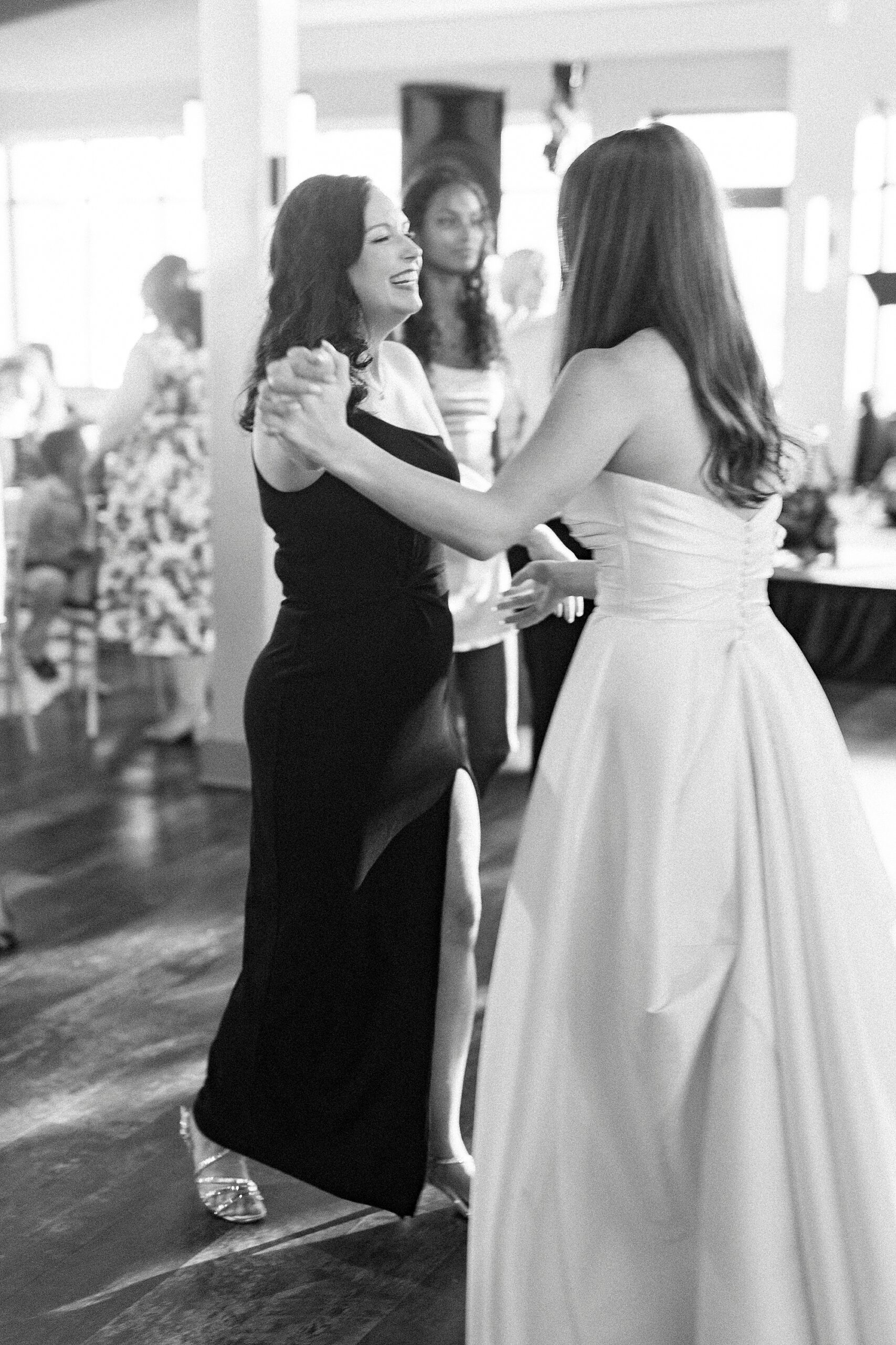 bride and guest dance during reception at Terrace at Cedar Hill