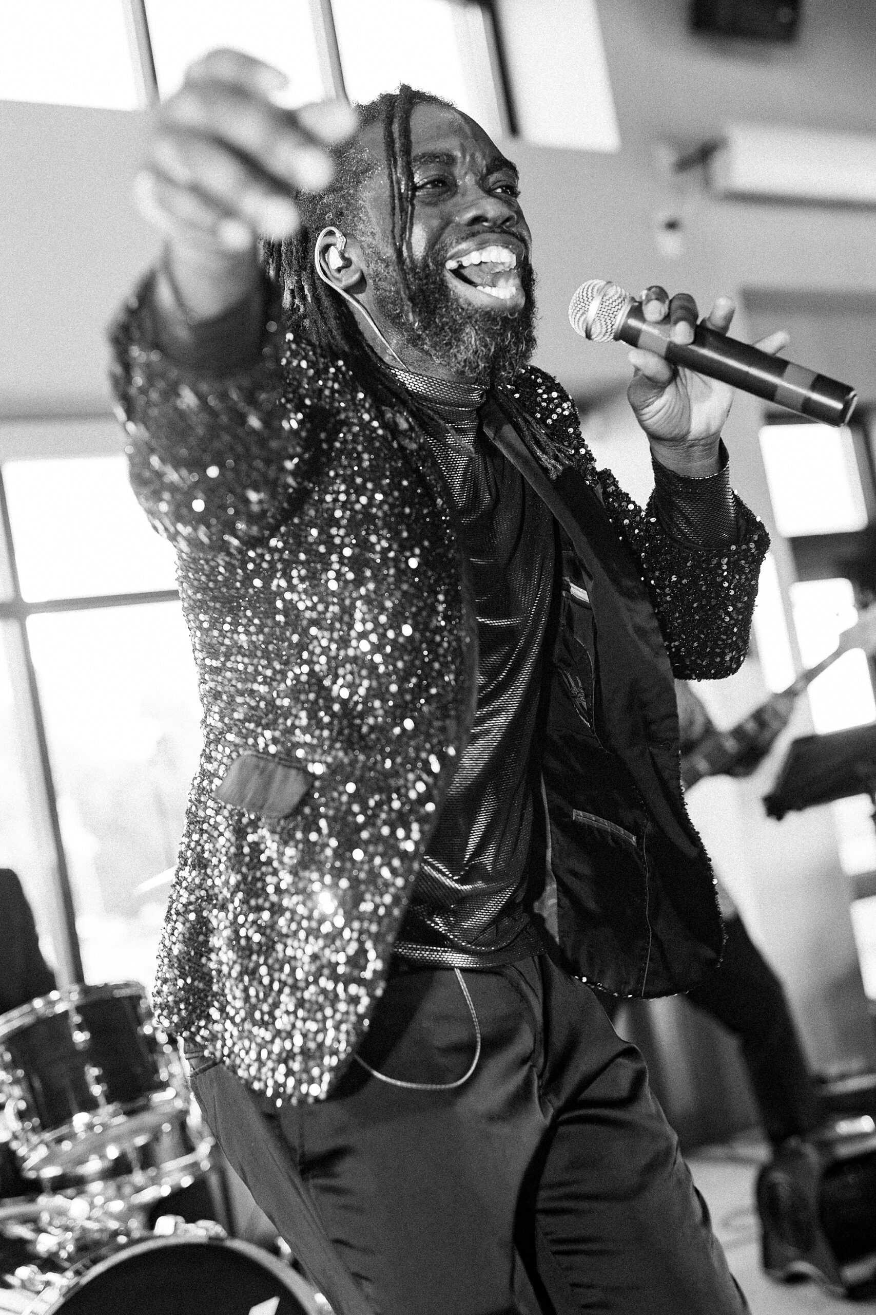 performer sings during reception at Terrace at Cedar Hill