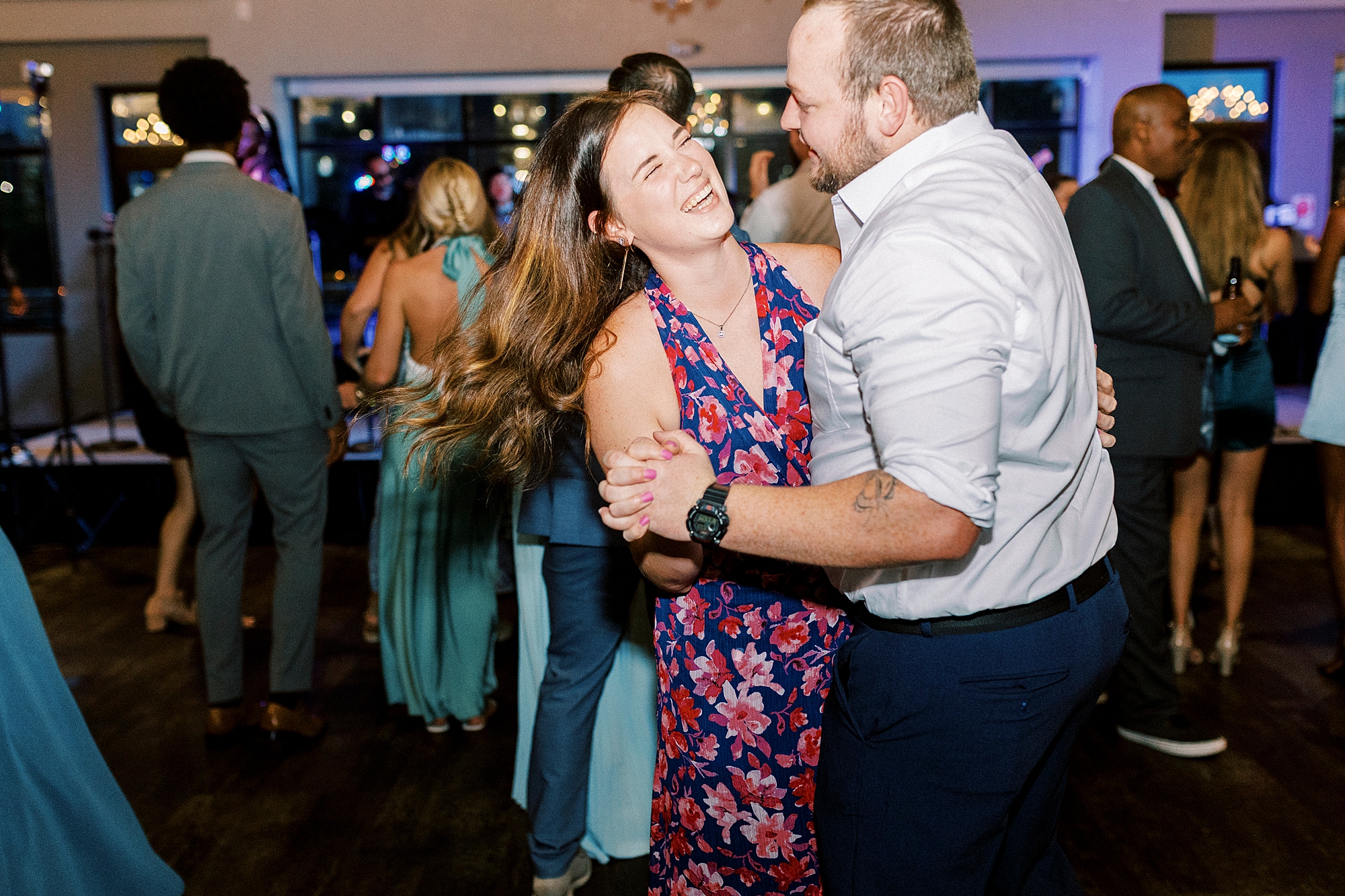 man and woman dance together during reception in Charlotte NC