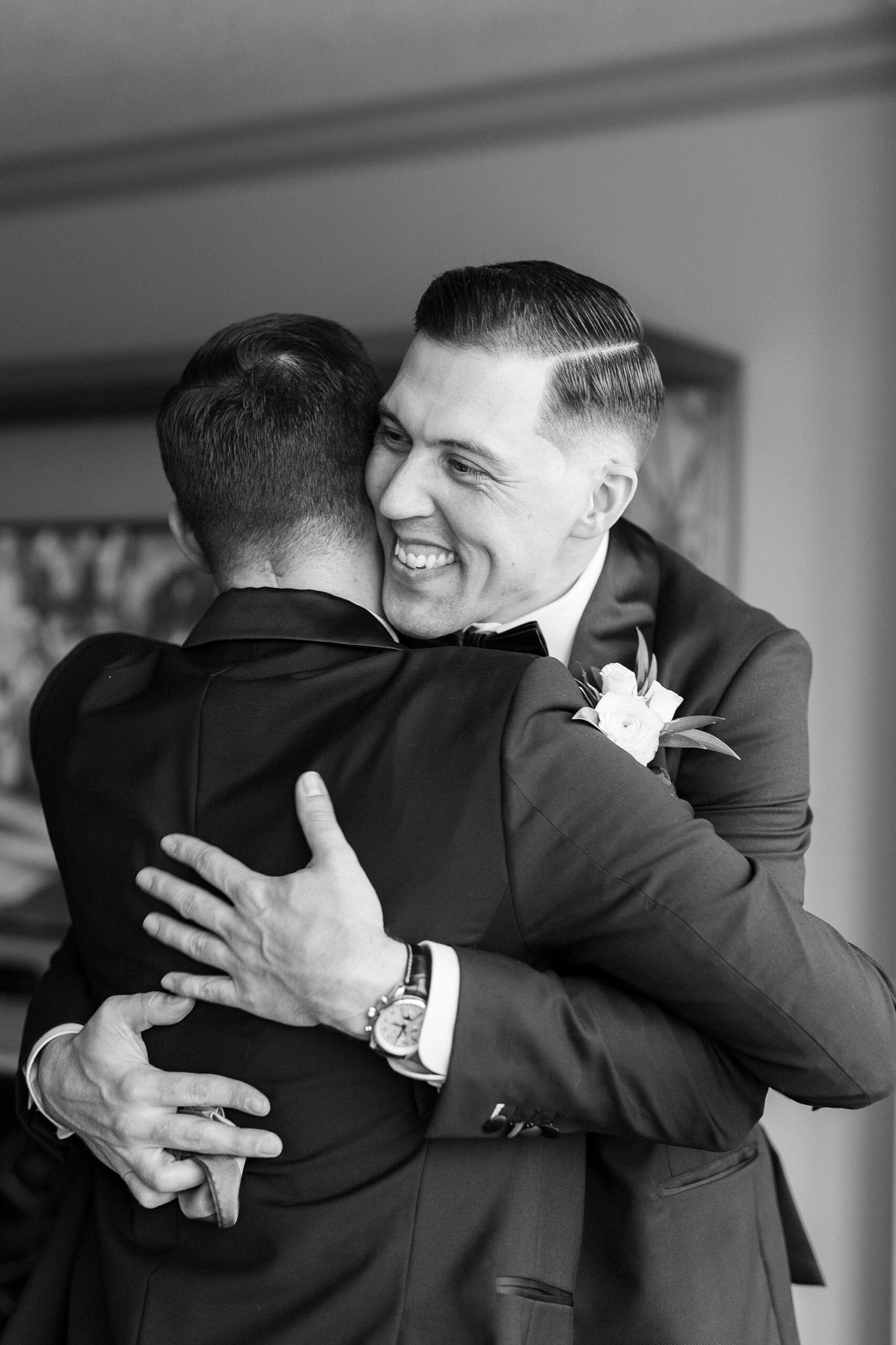 groom hugging groomsmen