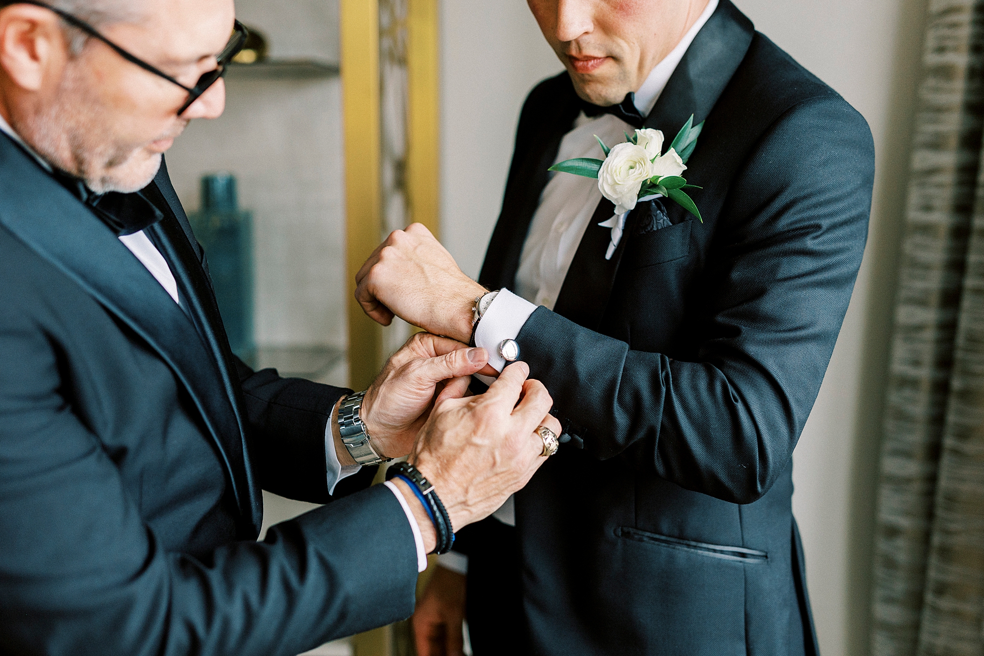 groom getting cufflinks on