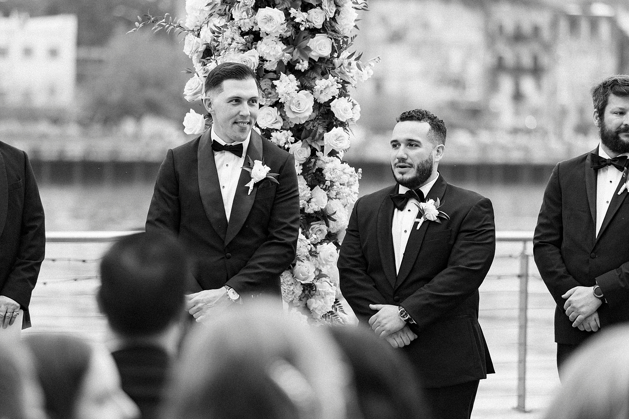 groom watching bride walk down the aisle 