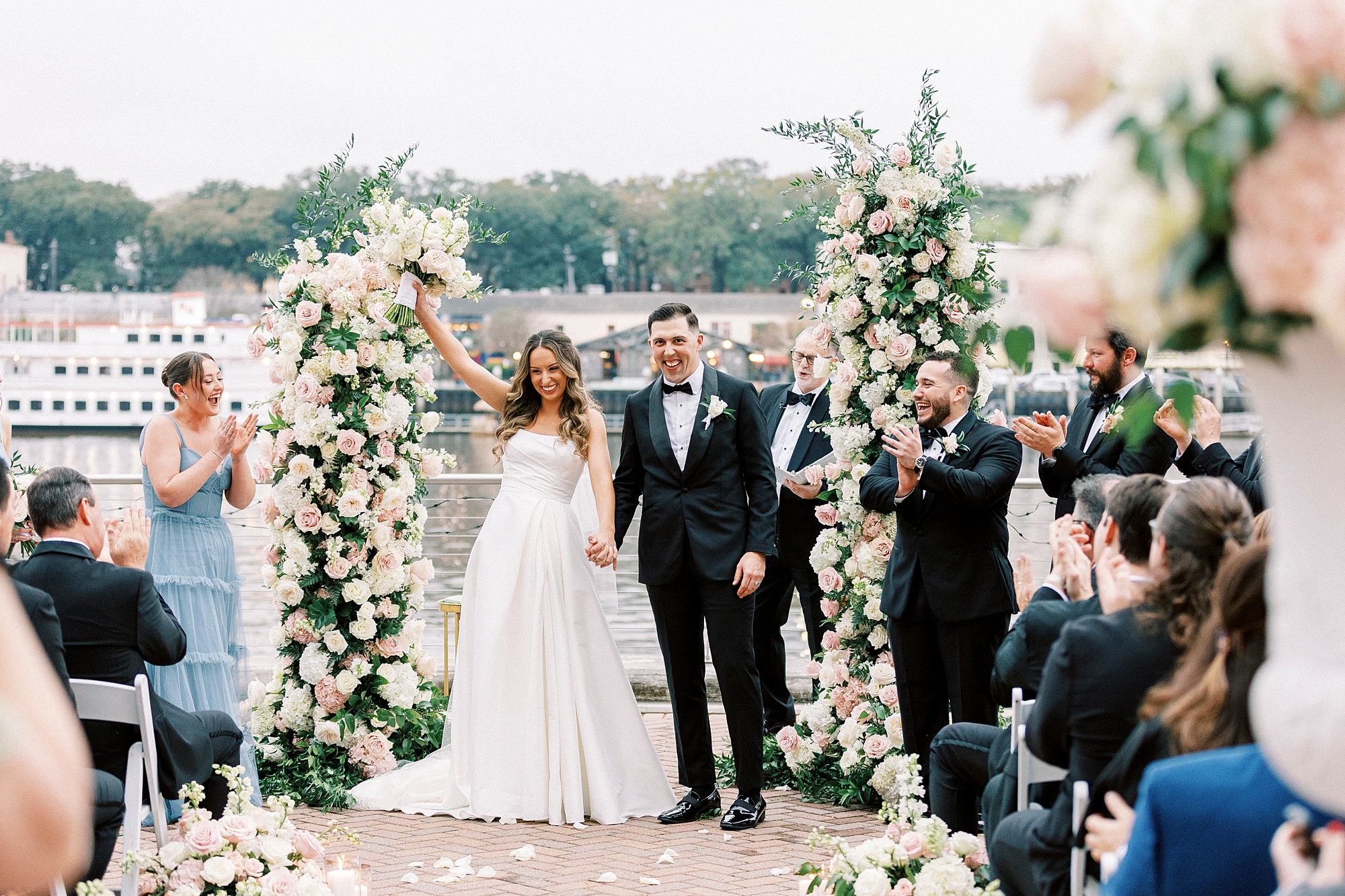 bride and groom celebrate after wedding ceremony