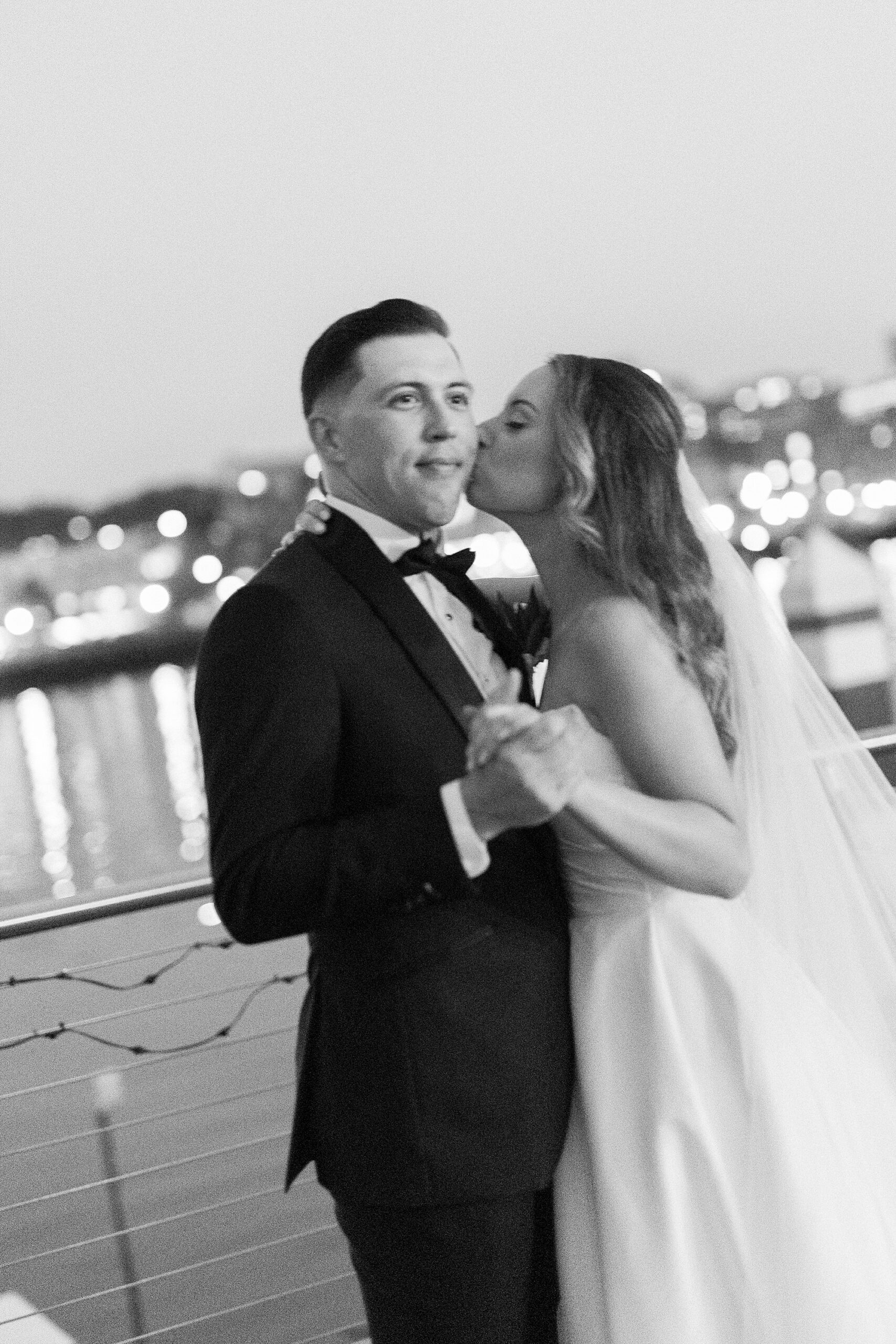 bride kisses groom's cheek