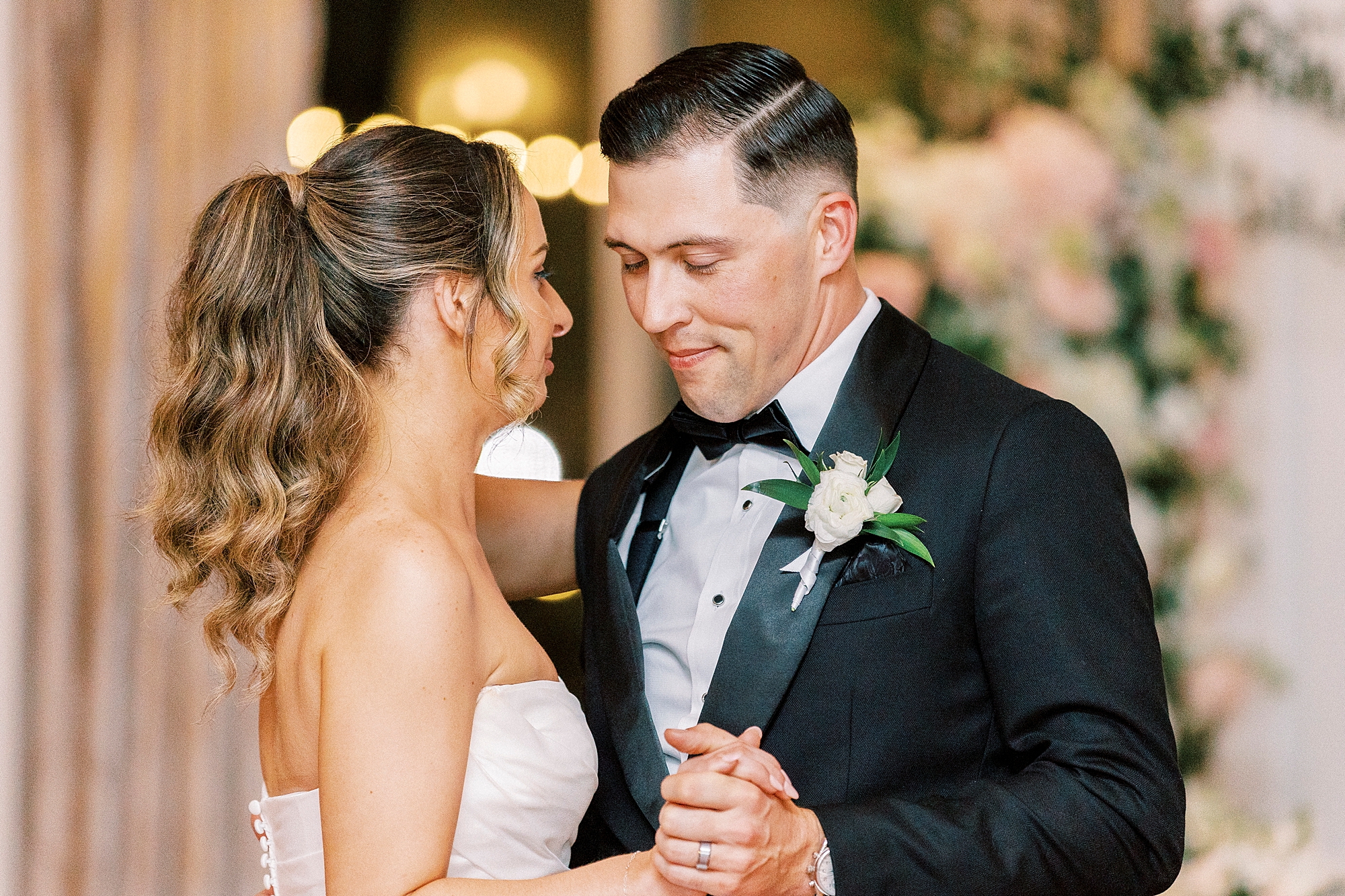 newlyweds share first dance at reception