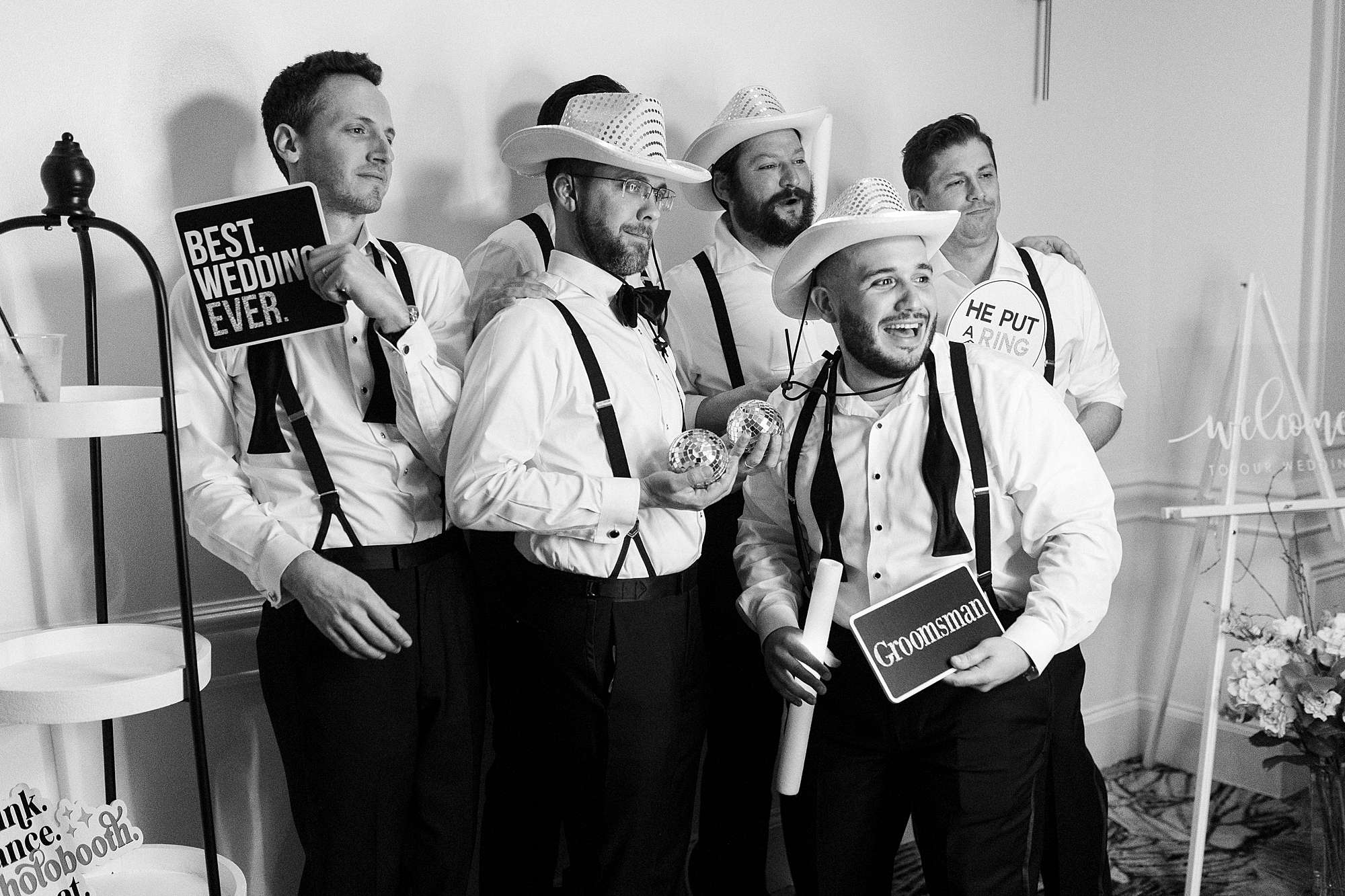 groomsmen posting with props 