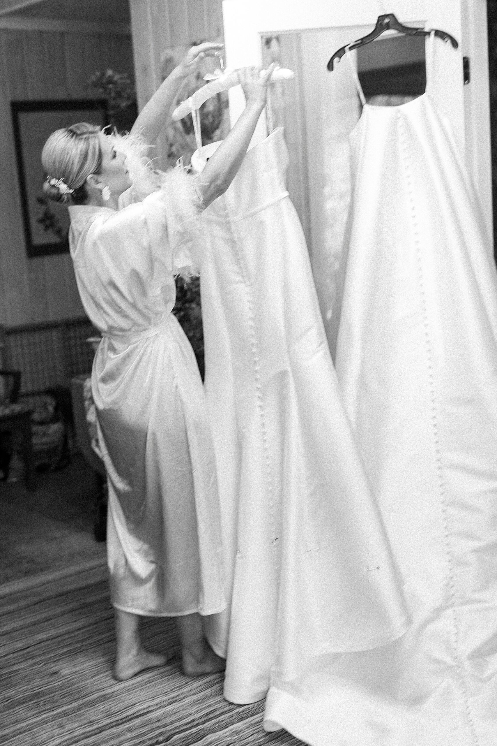 bride looking at wedding dress