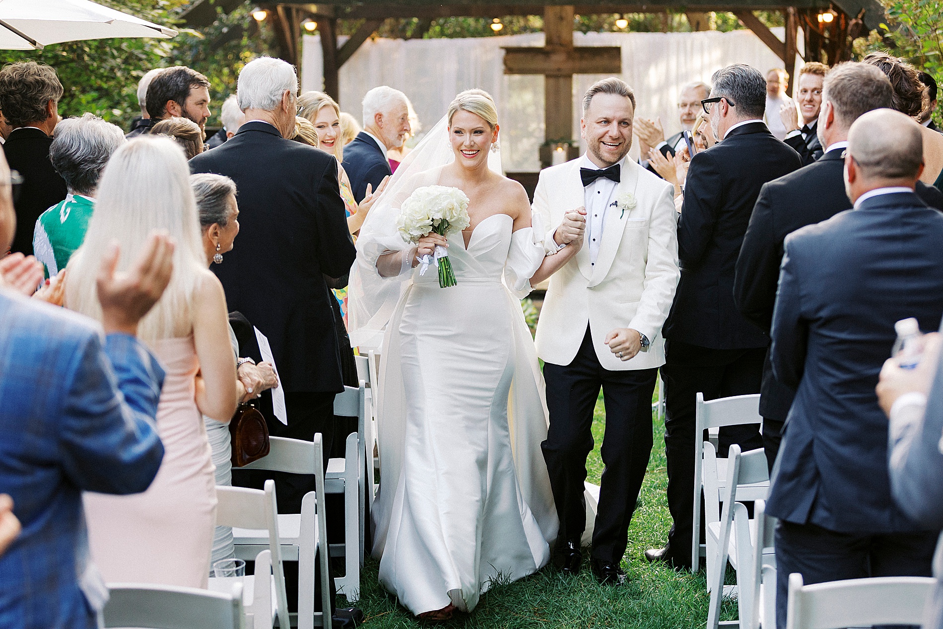 Newlyweds exit wedding ceremony