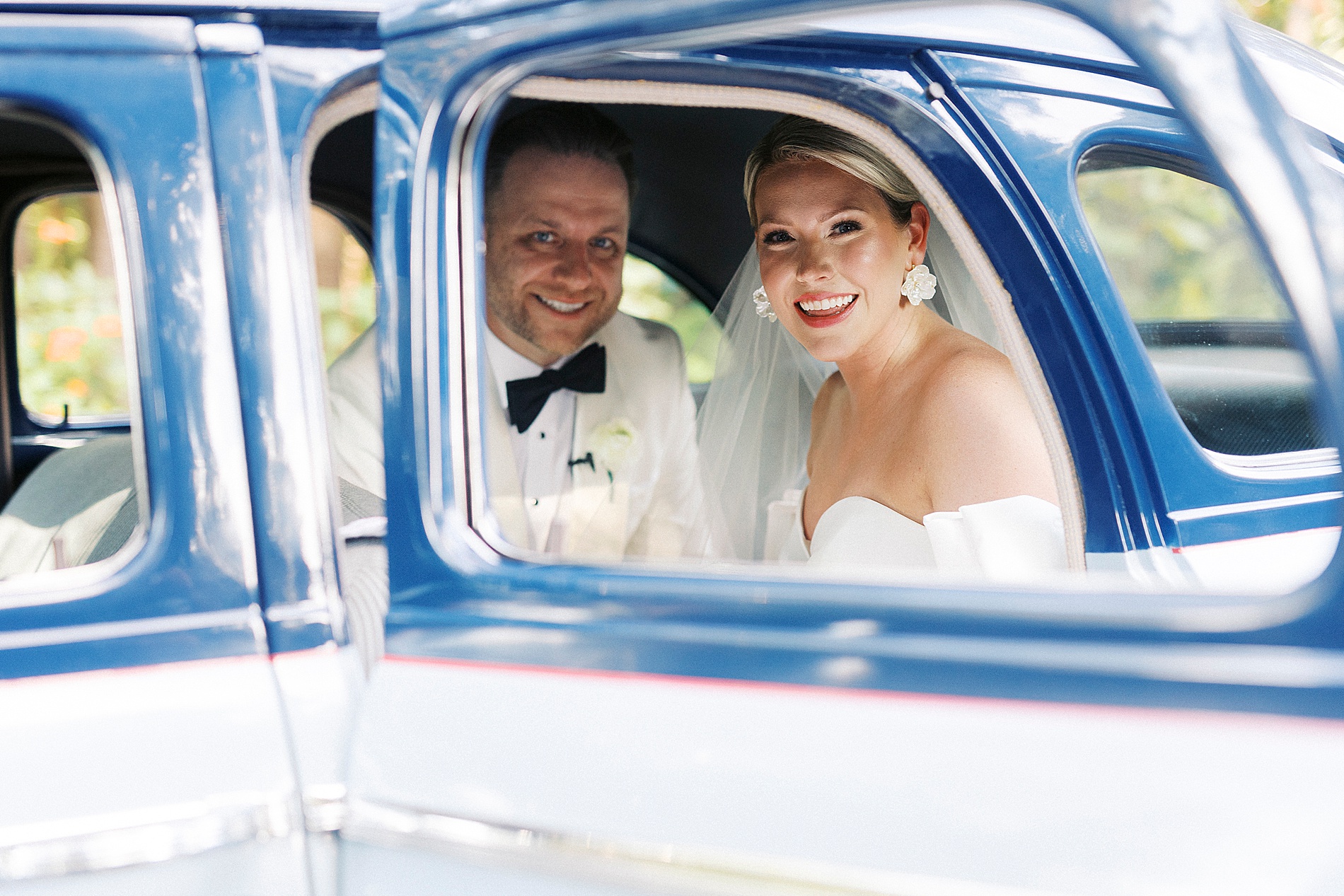 newlyweds in getaway car
