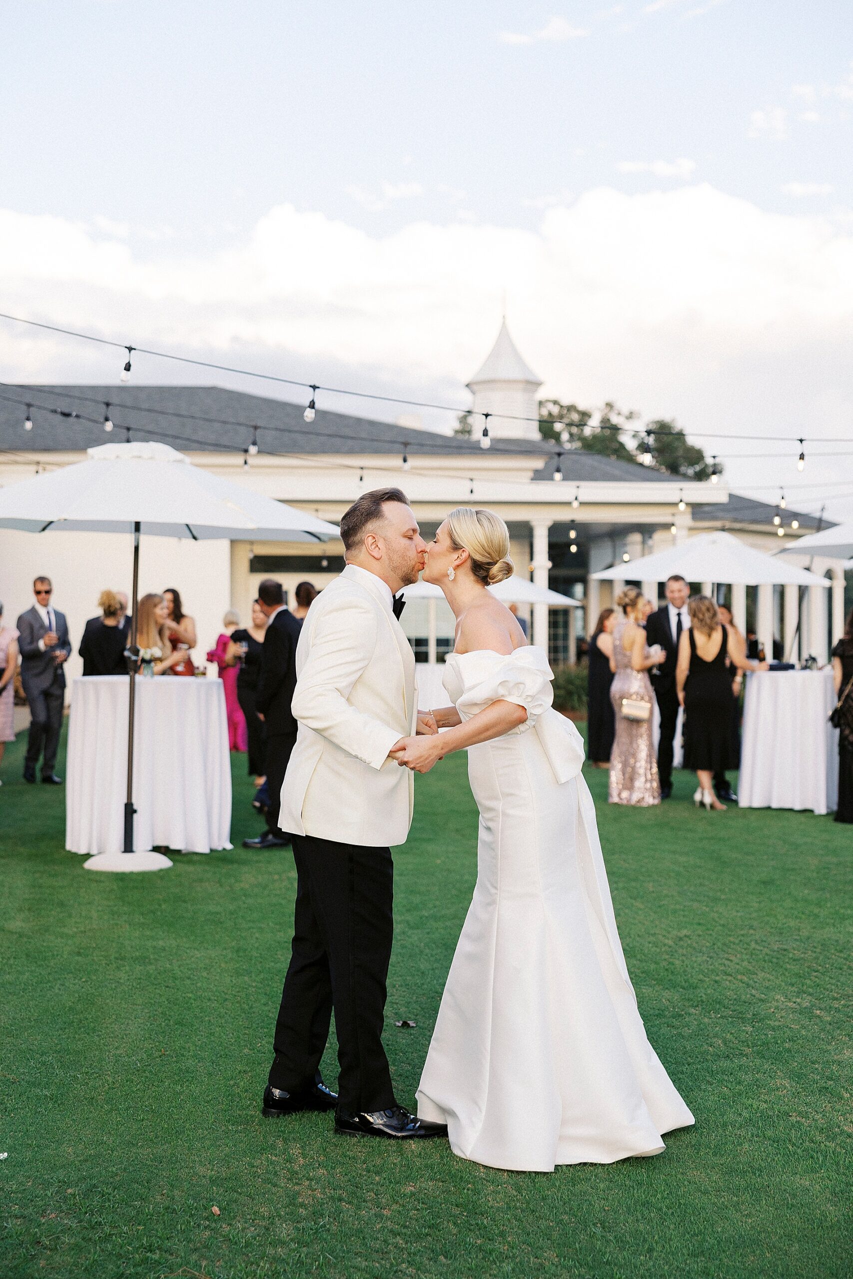 newlyweds kiss at Gaston Country Club Wedding