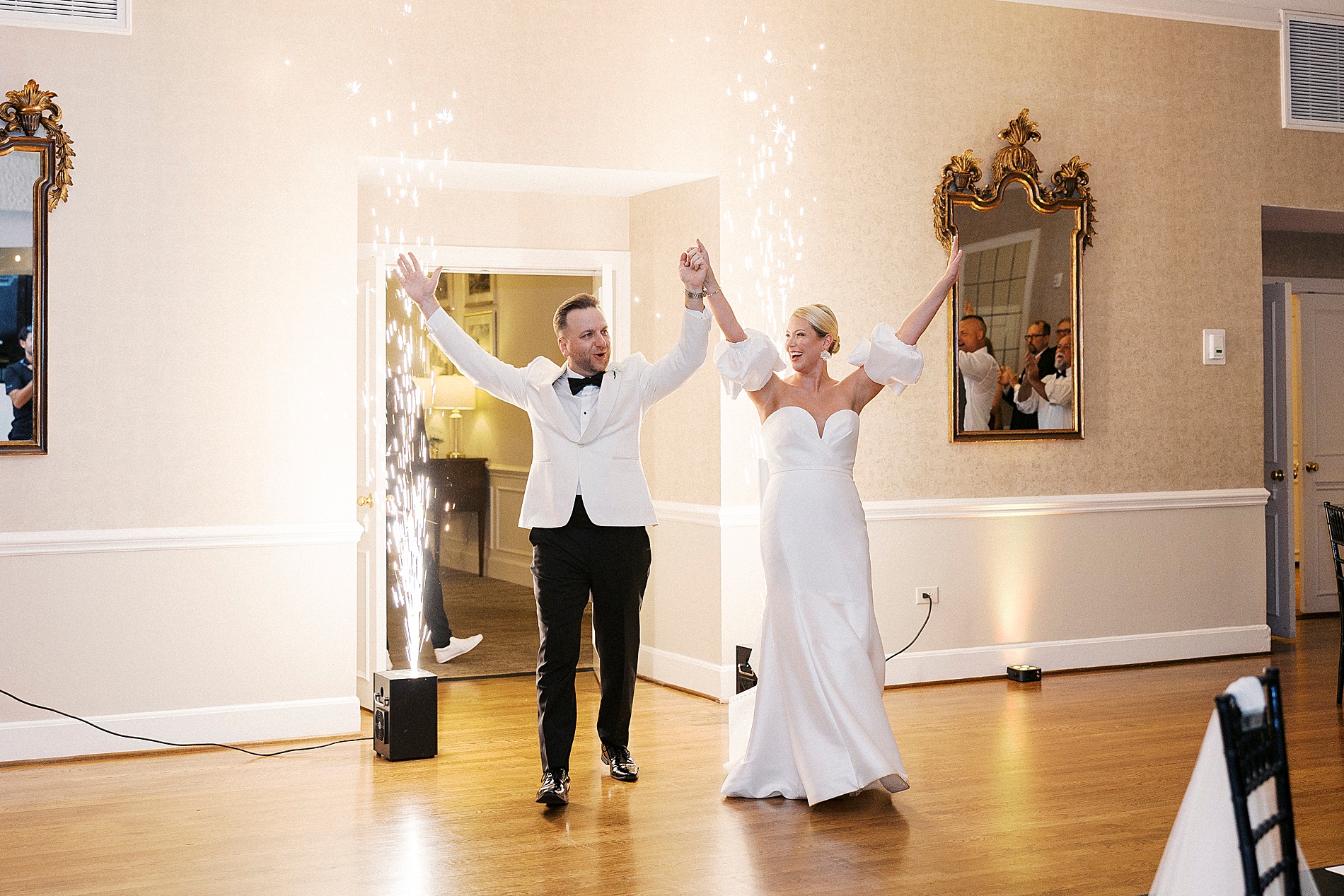 newlyweds make their grand entrance to Gaston Country Club Wedding reception