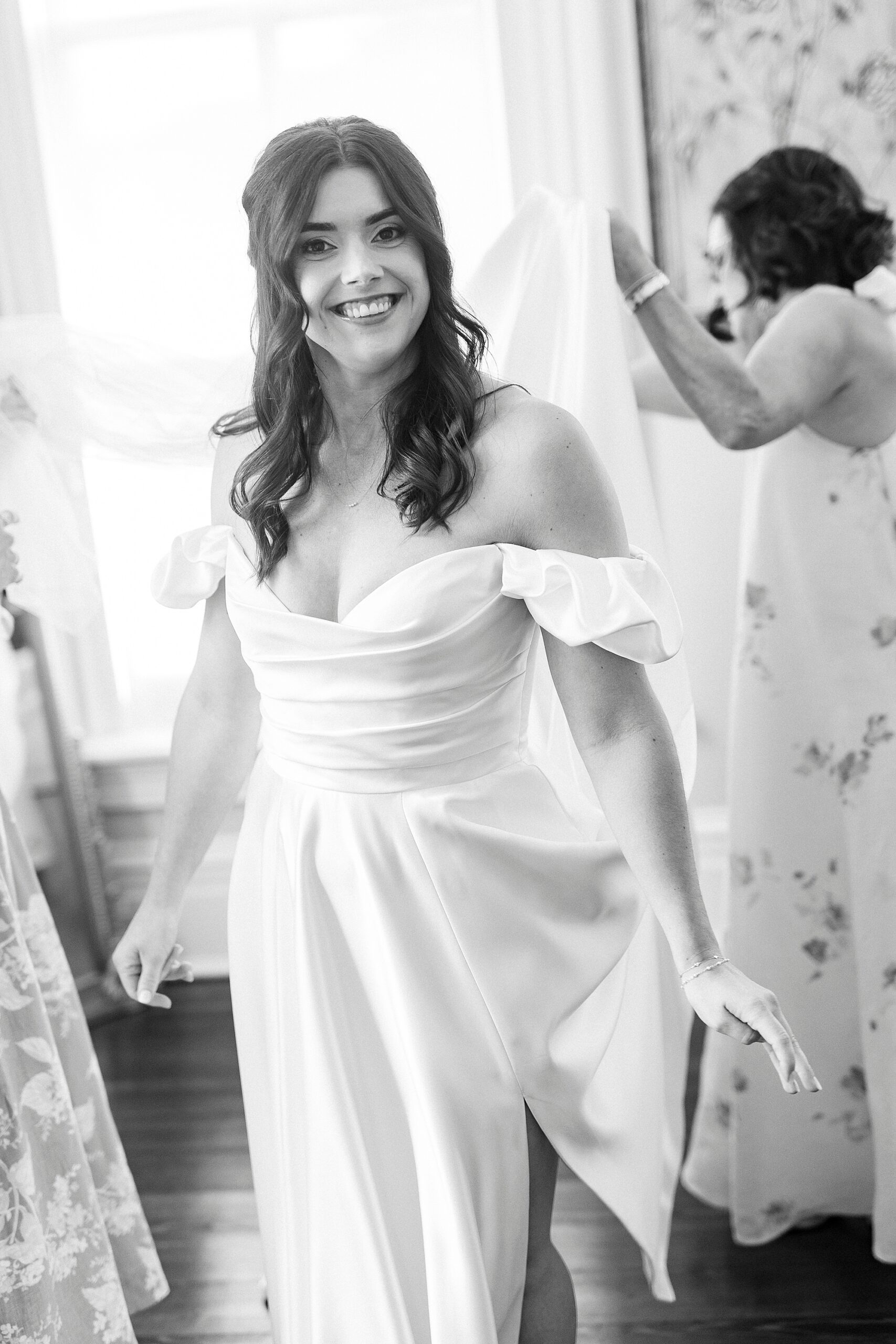 bride getting into wedding dress