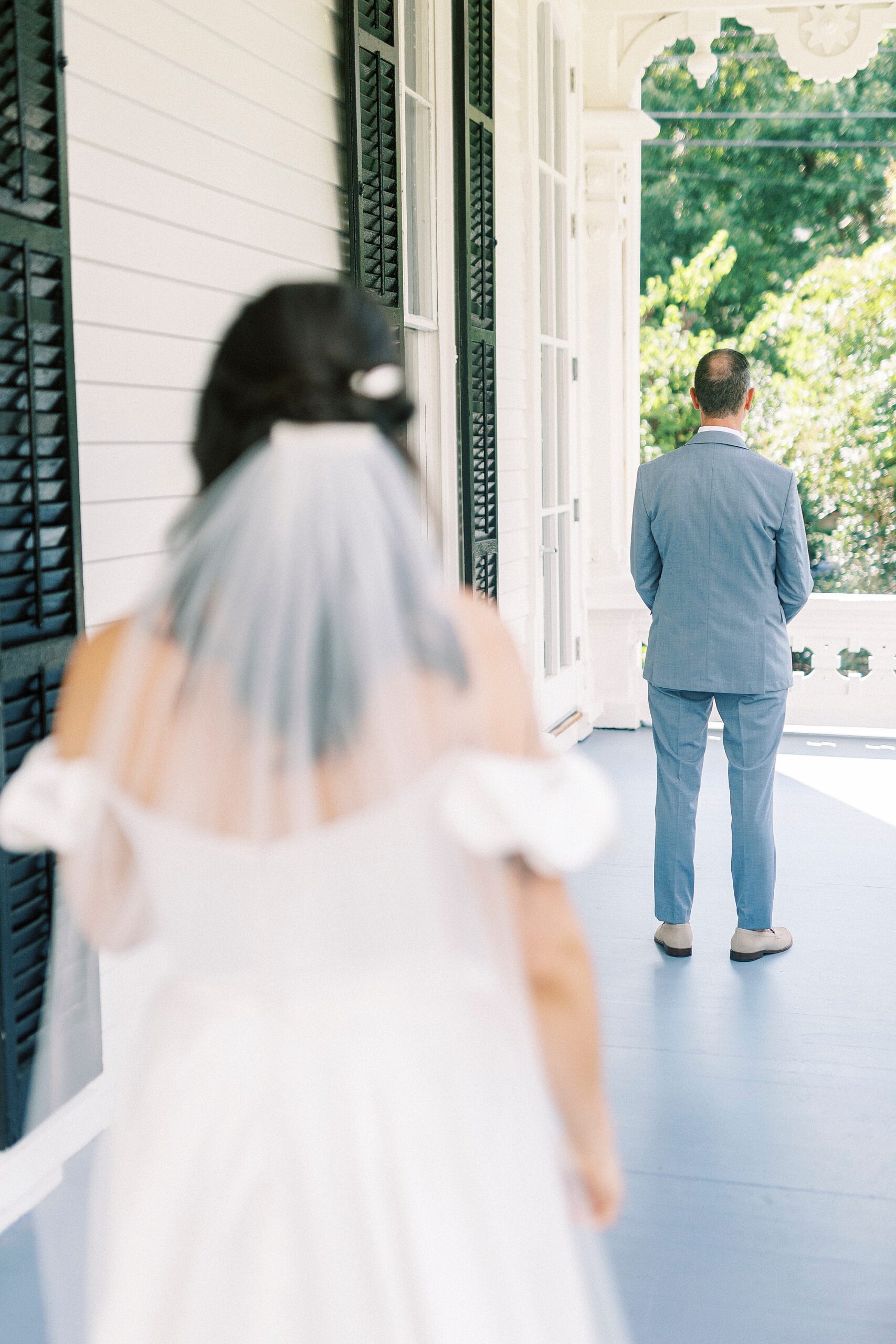 bride on porch before father-daughter first look