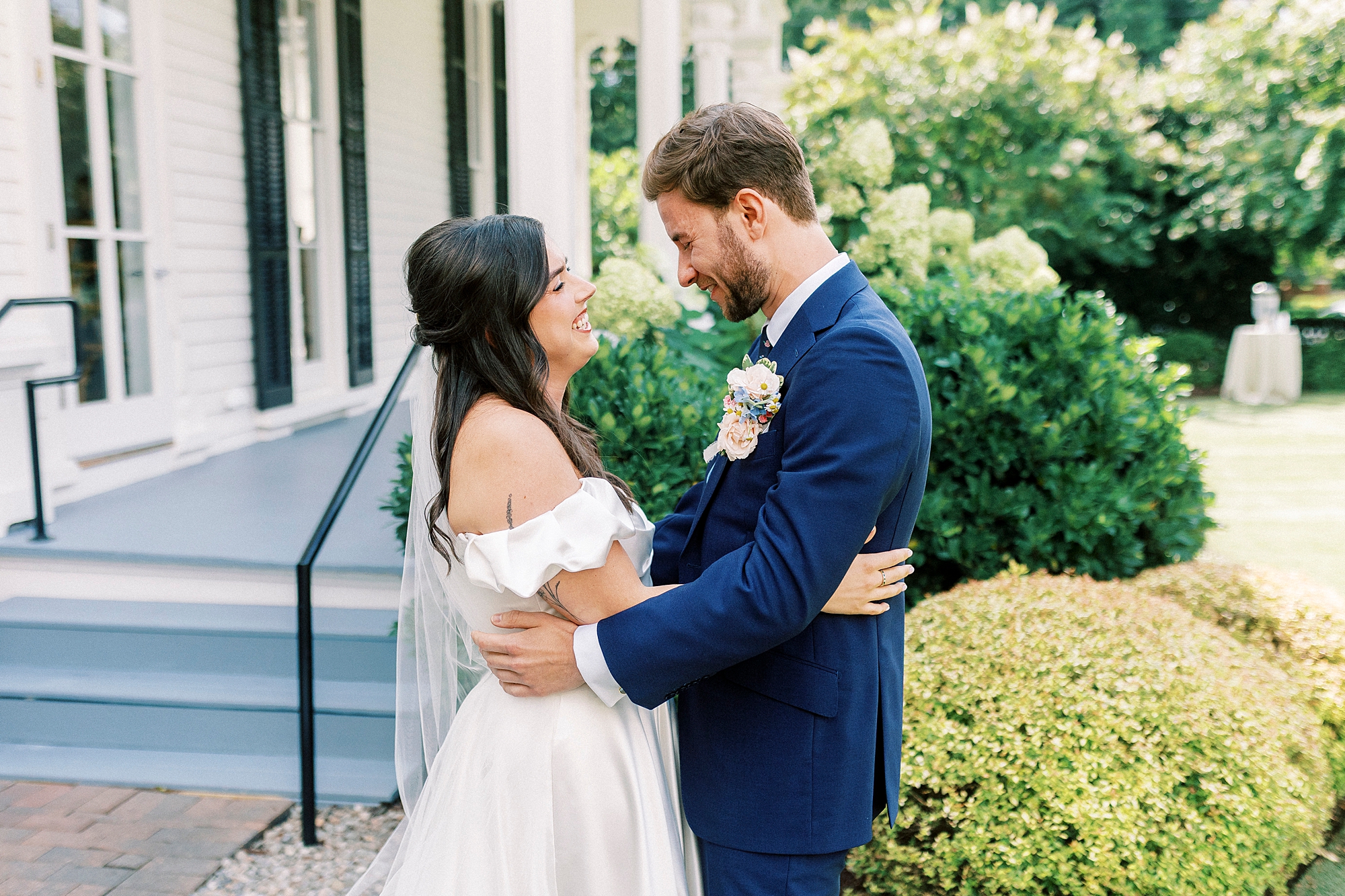 bride and groom look at each other 