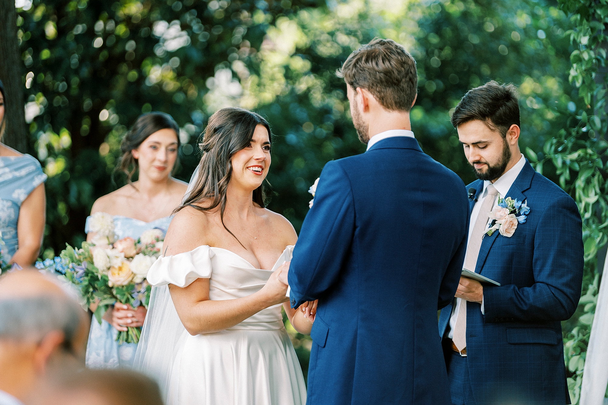 bride and groom exchange vows during wedding ceremony 