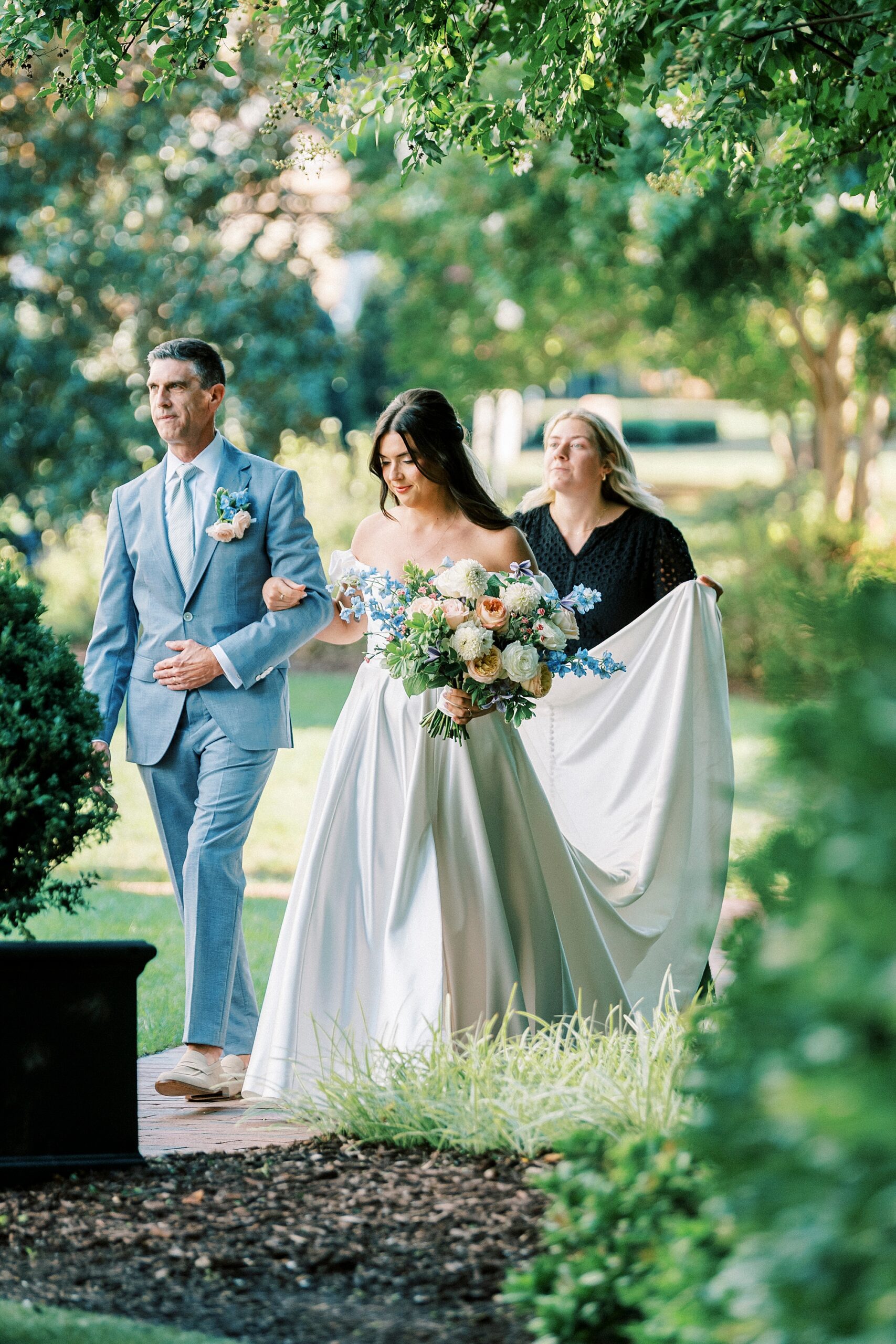 bride walking down aisle with father