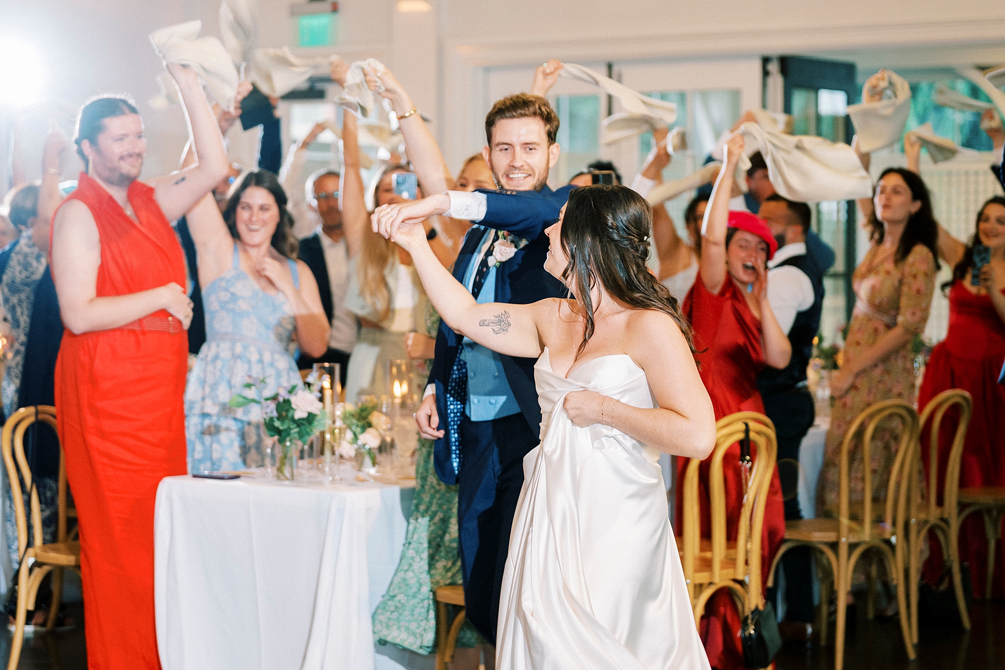 newlyweds enter wedding reception 