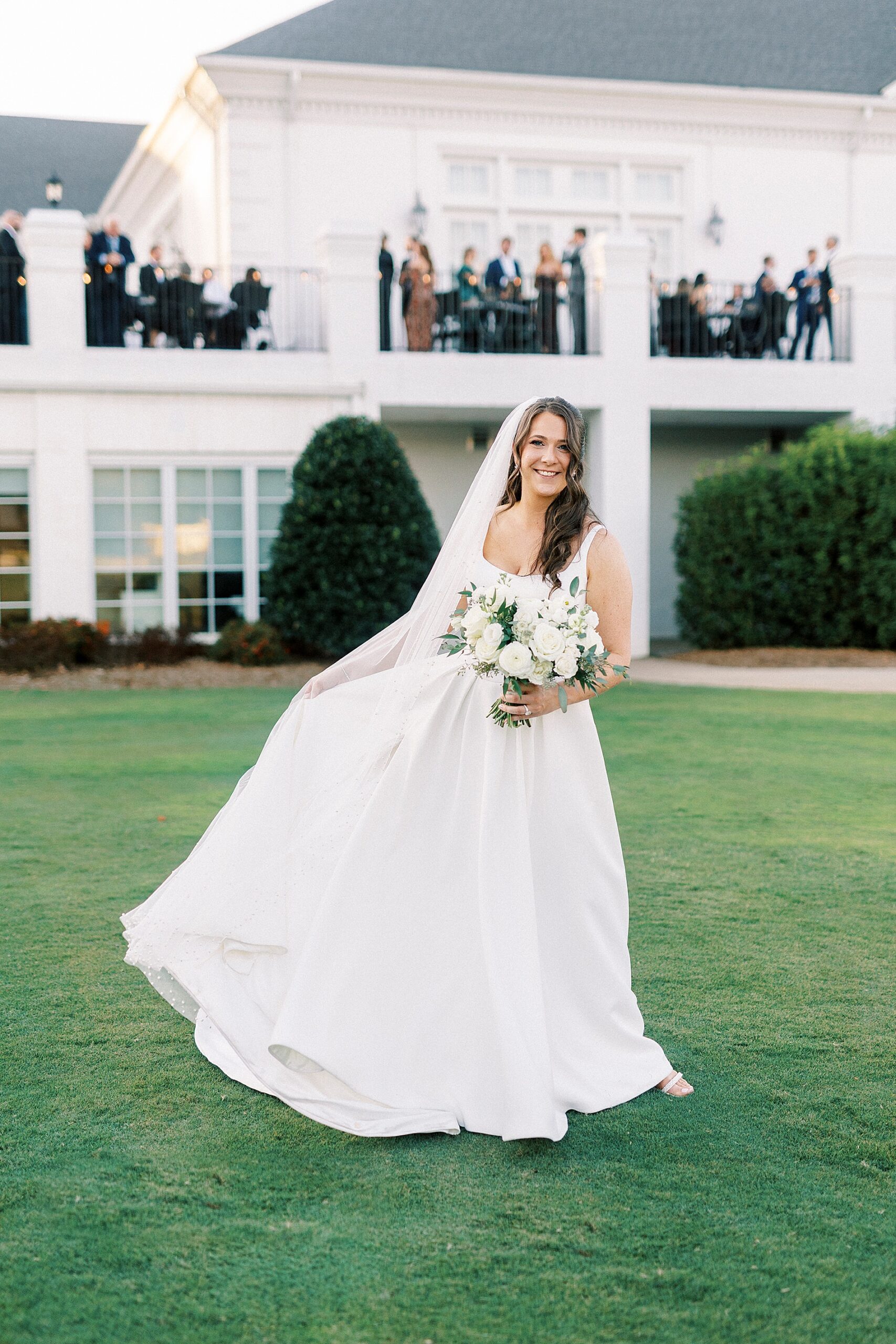 bride on lawn of Providence Country Club  