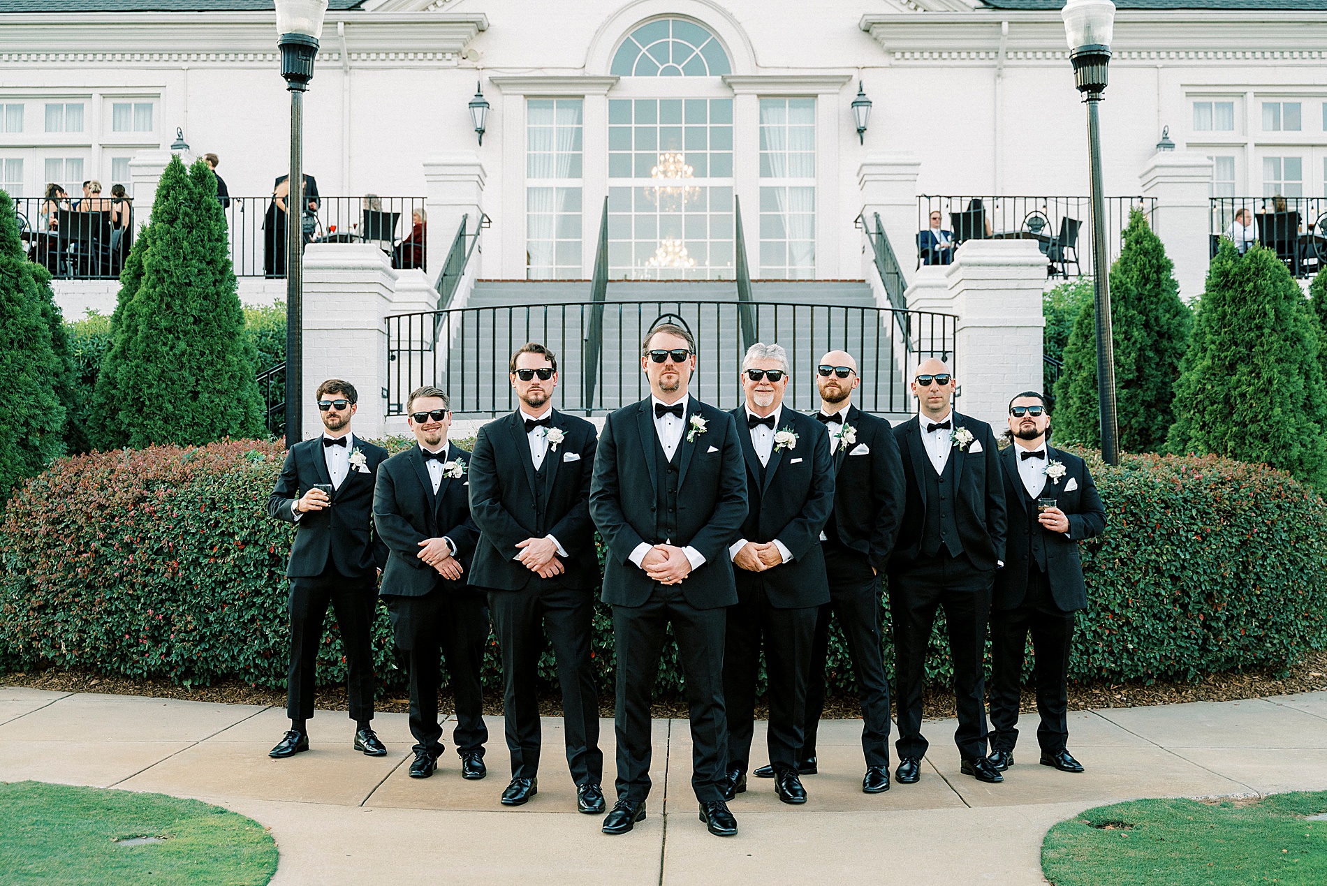 groom and groomsmen outside of Providence Country Club  