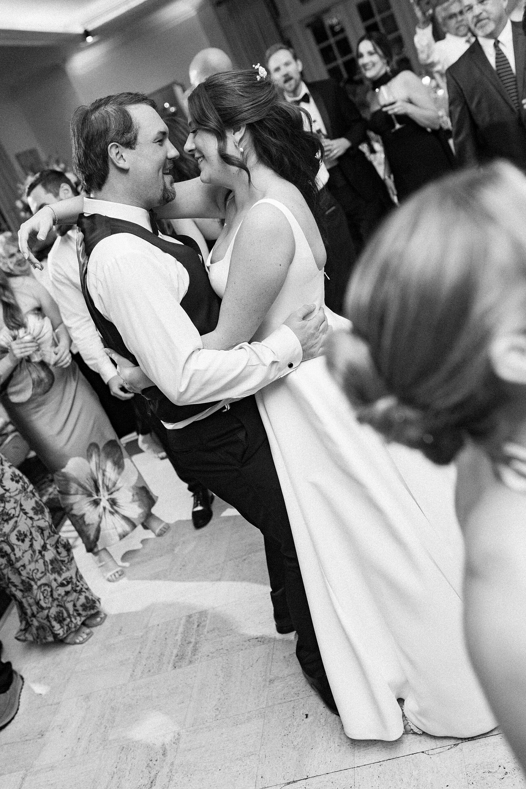 candid bride and groom photos on dance floor 