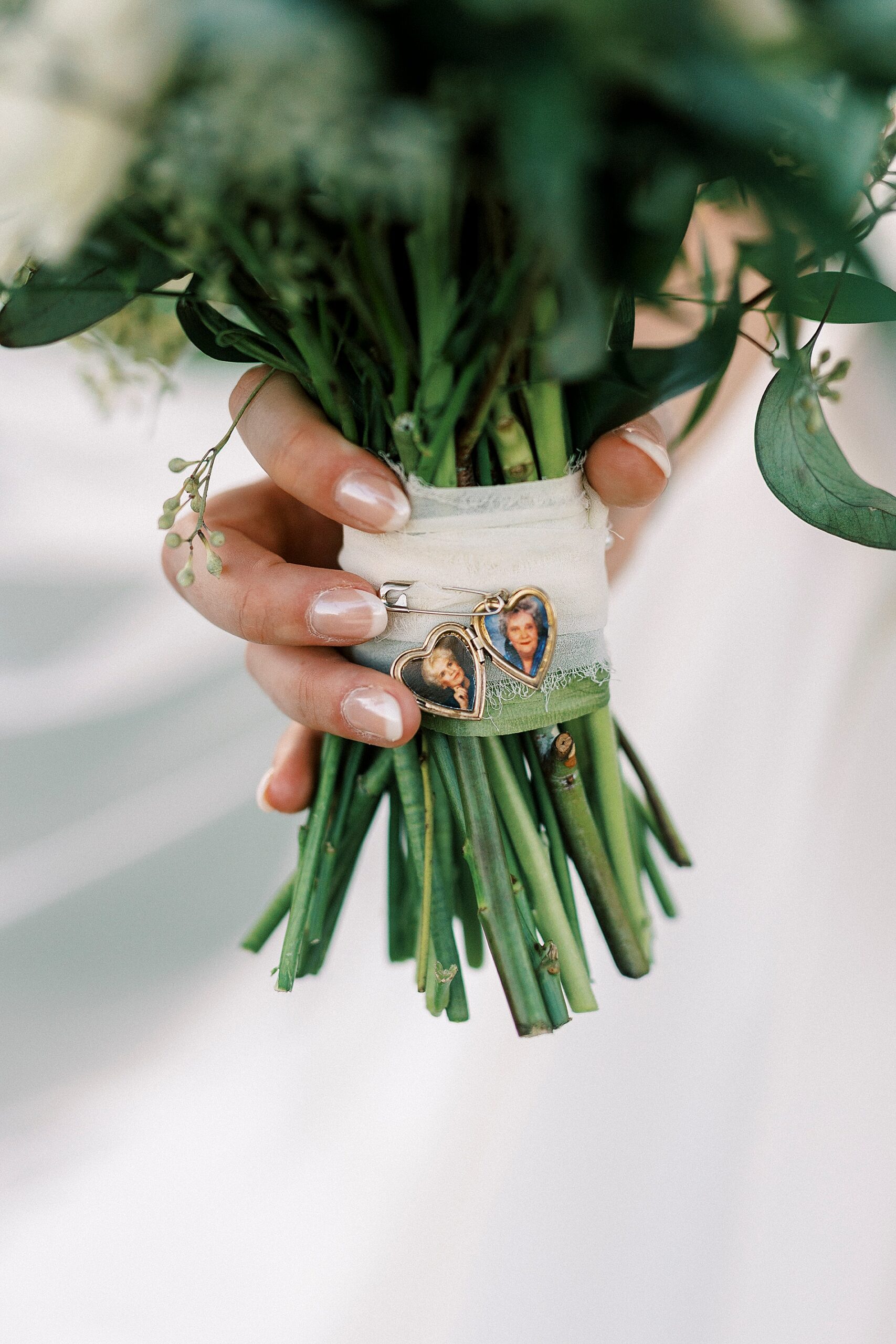 bridal bouquet with charm around stems 