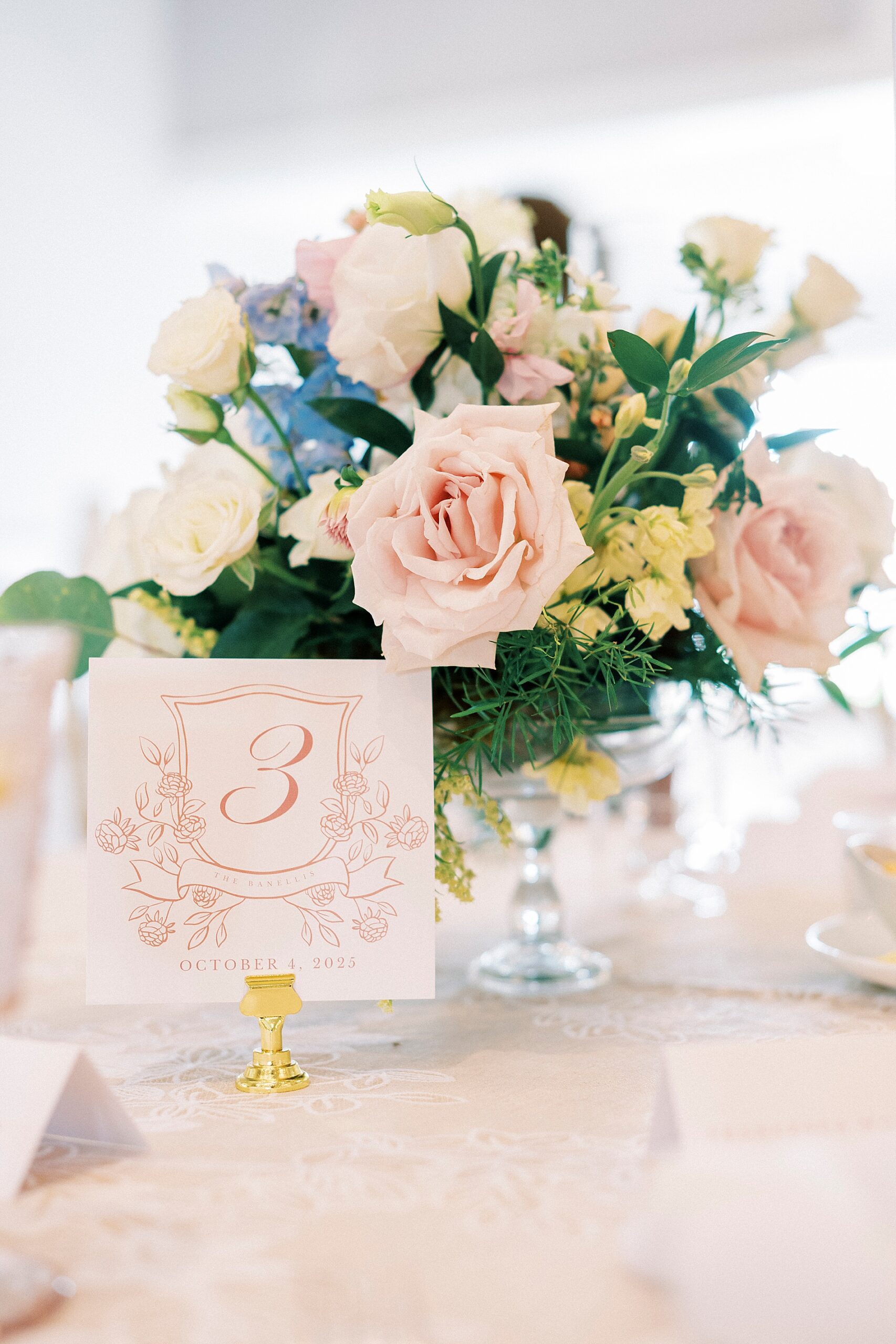 soft florals and table numbers at elegant wedding reception