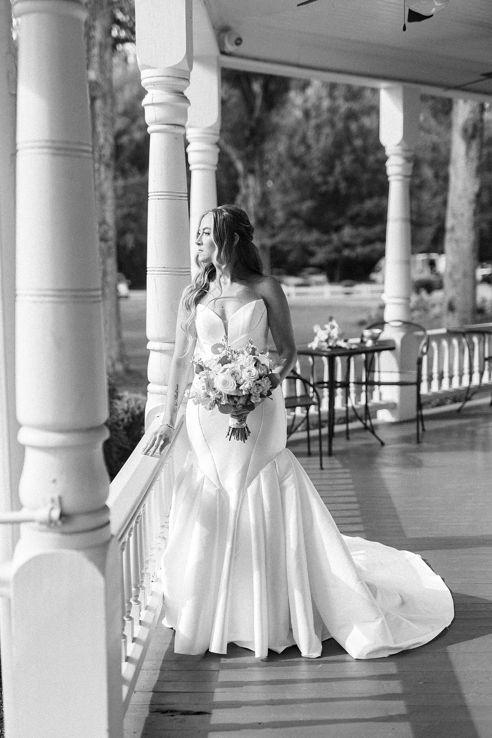 bride on front porch of The Brawley Estate