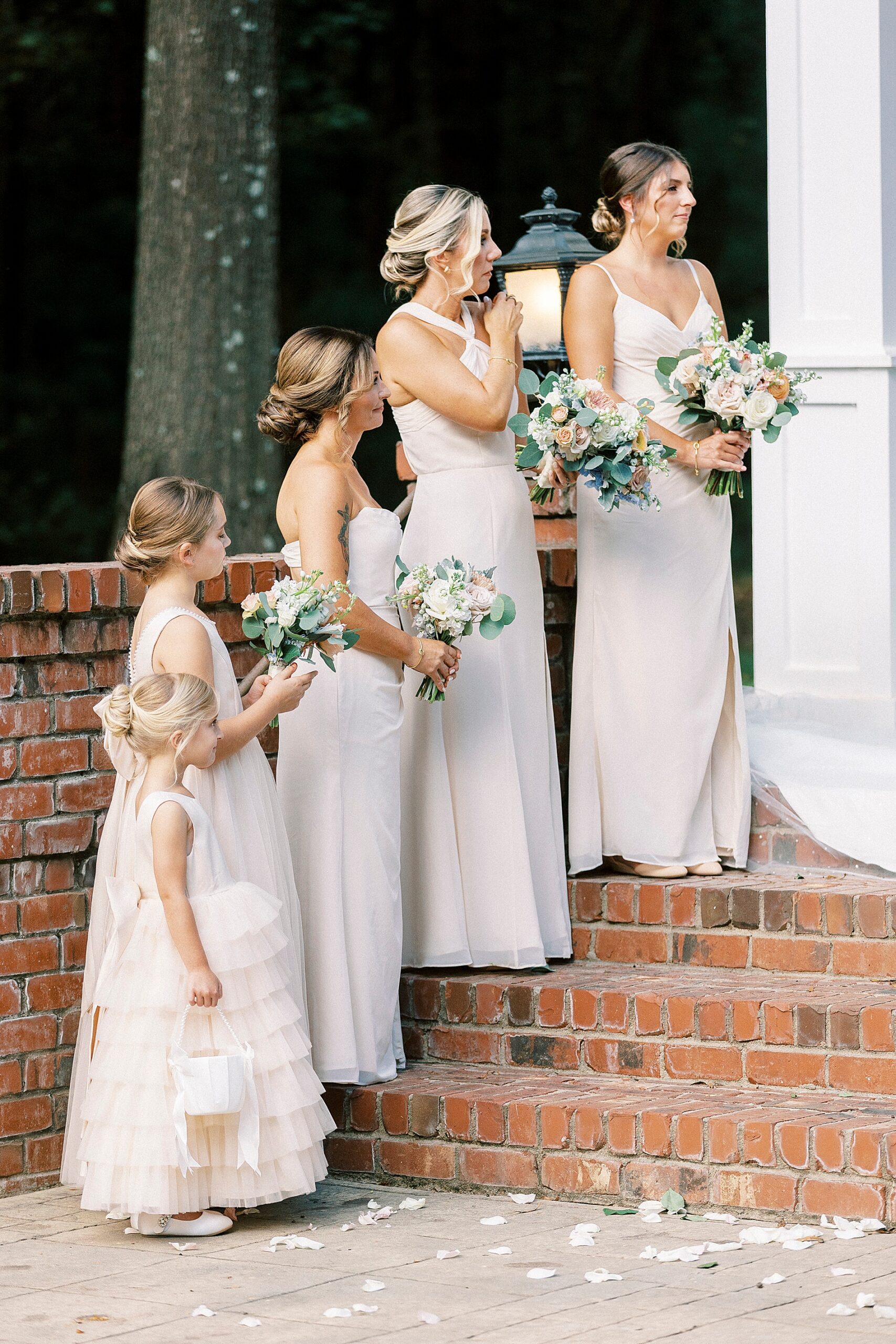 bridesmaids on stairs at wedding ceremony