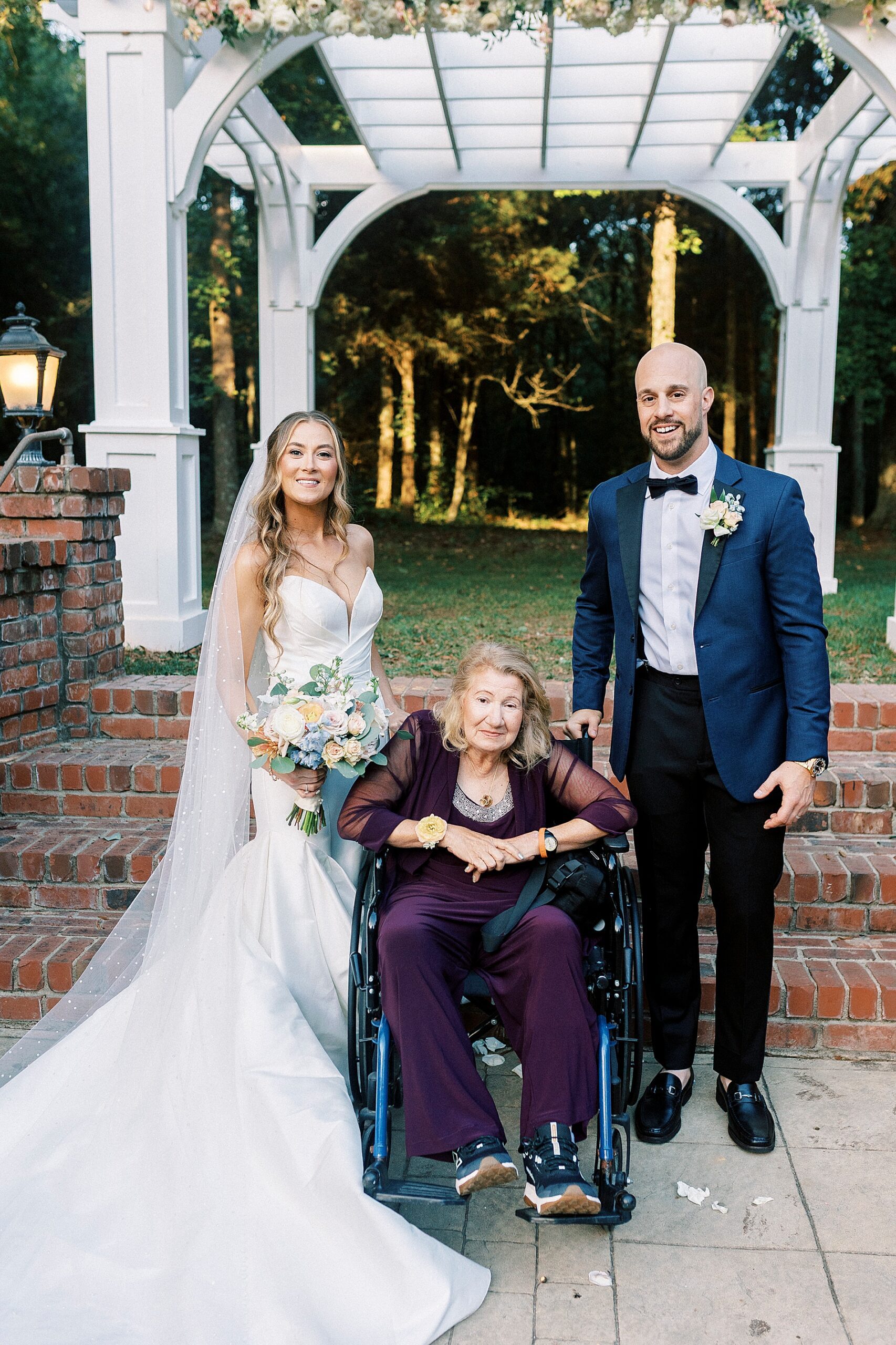 bride and groom with family member